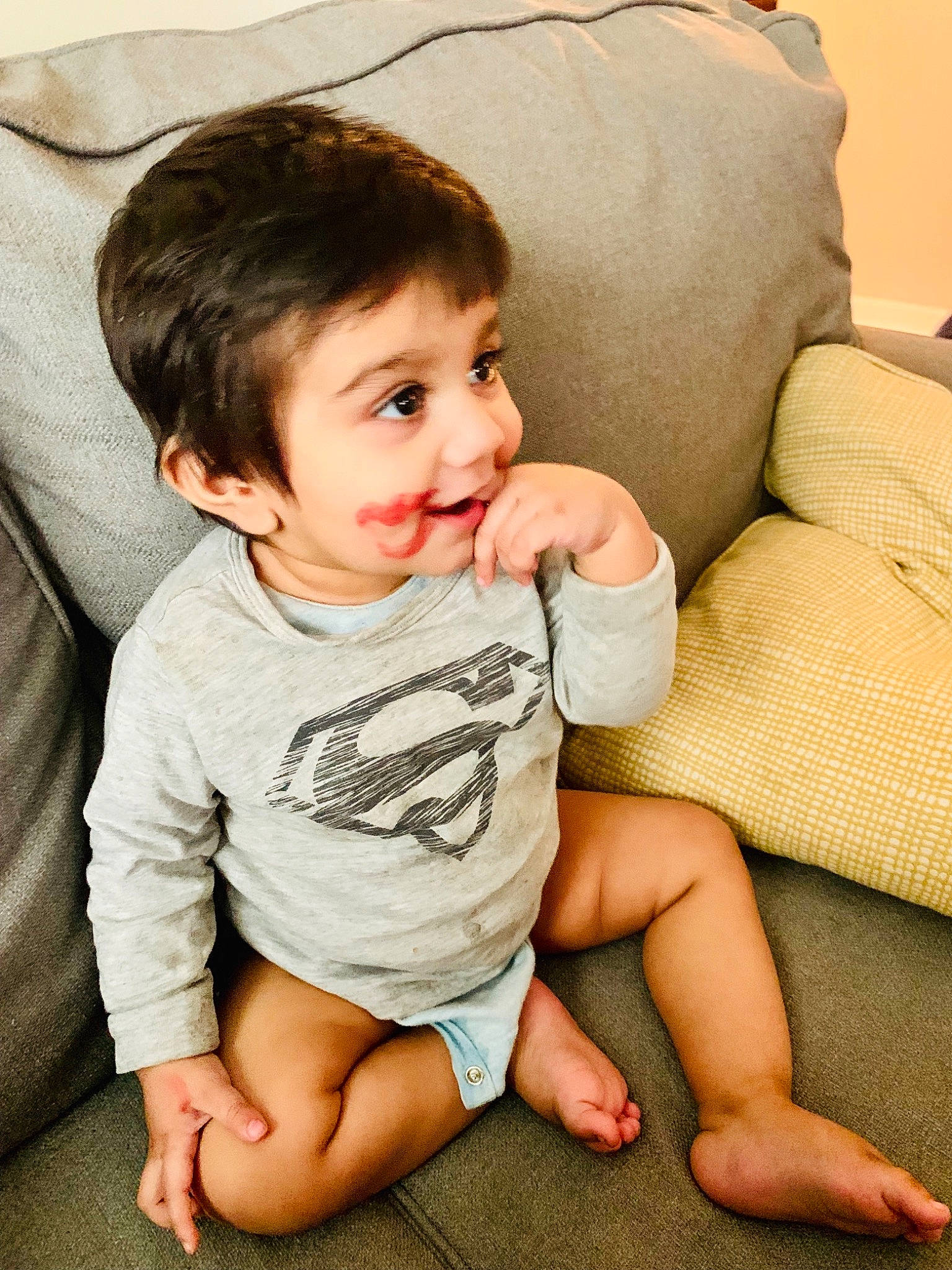 Hadi is registered to the contest to win money with this photo: arm, baby, baby_toddler_clothing, beauty, cheek, child, chin, facial_expression, happy, joy, leg, person, sitting, skin, sleeve, smile, toddler