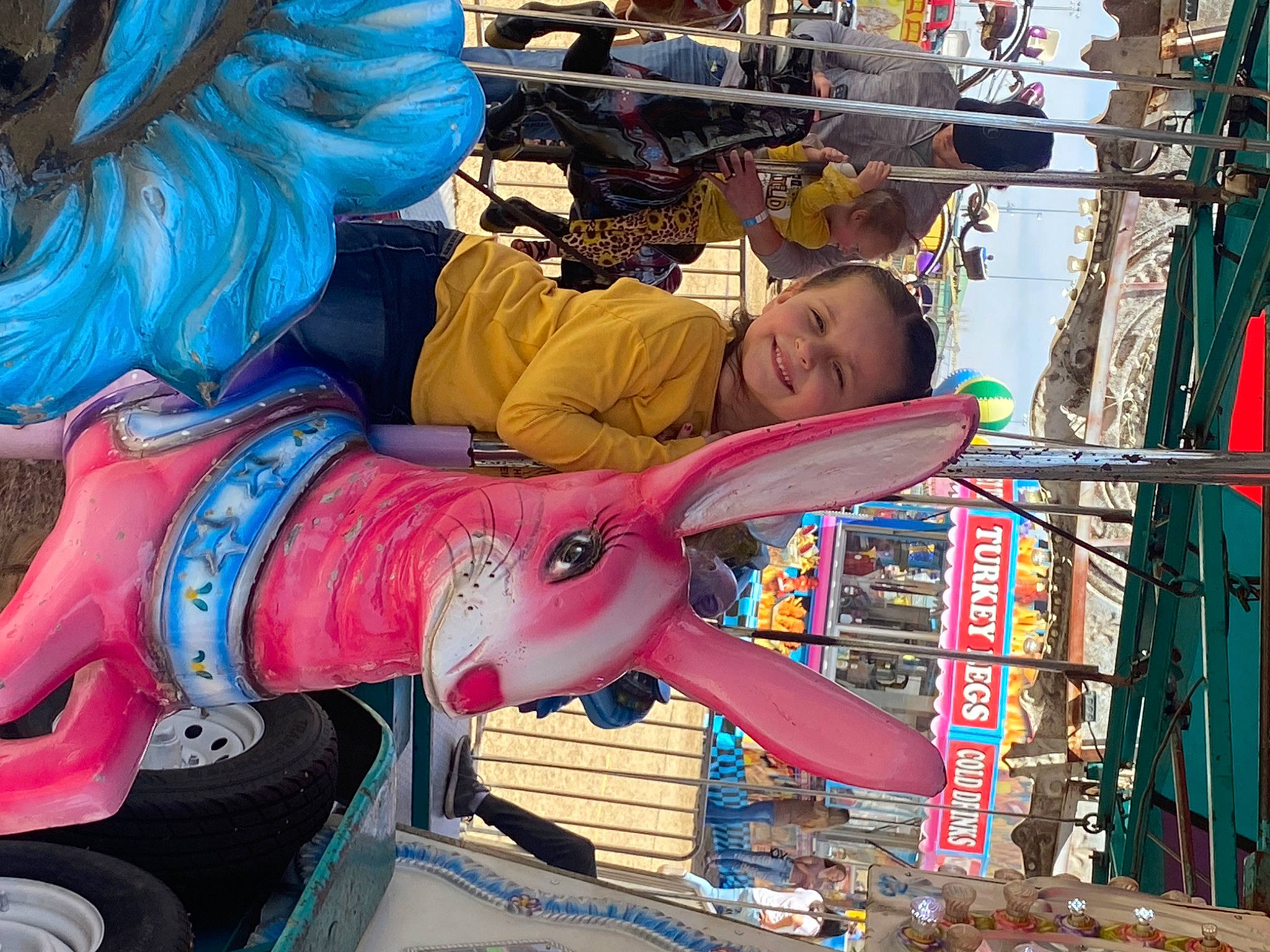 Lakenzie is registered to the contest to win money with this photo: amusement_park, amusement_ride, art, bazaar, blue, child, city, event, fun, joy, leisure, magenta, market, marketplace, person, public_space, recreation, textile, toddler, travel