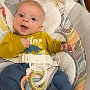 Archer is registered to the contest to win money with this photo: baby, bed, bodypart, clothing, crib, cushion, face, finger, furniture, head, homedecor, infantbed, jeans, newborn, pants, person, photography, portrait, sitting, t_shirt