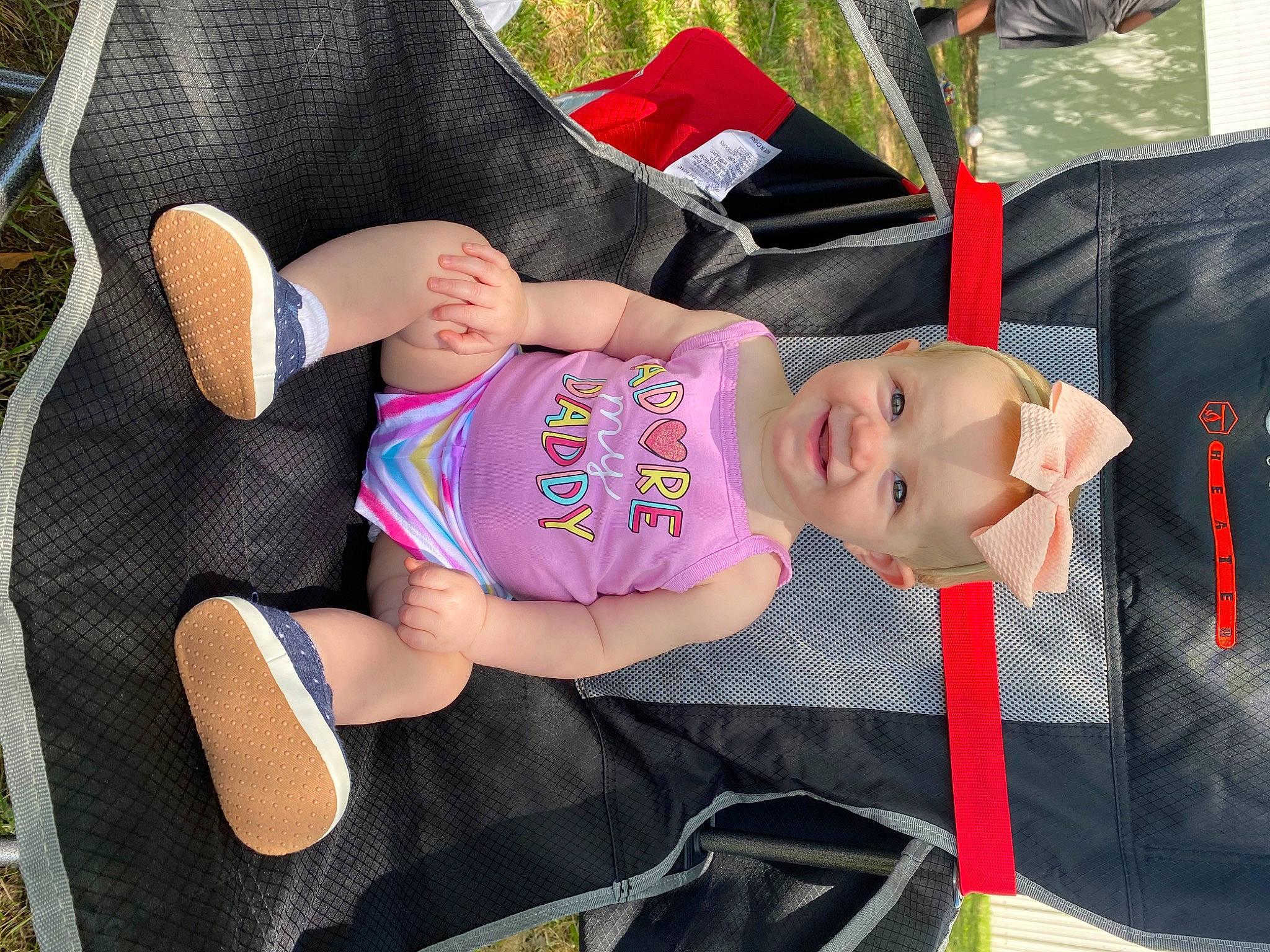 Rileigh Ann is registered to the contest to win money with this photo: auto_part, baby, baby_carriage, baby_products, baby_toddler_clothing, car_seat, child, comfort, fashion_accessory, glasses, grass, hat, human_leg, joy, leg, pattern, person, sleeve, sock, textile