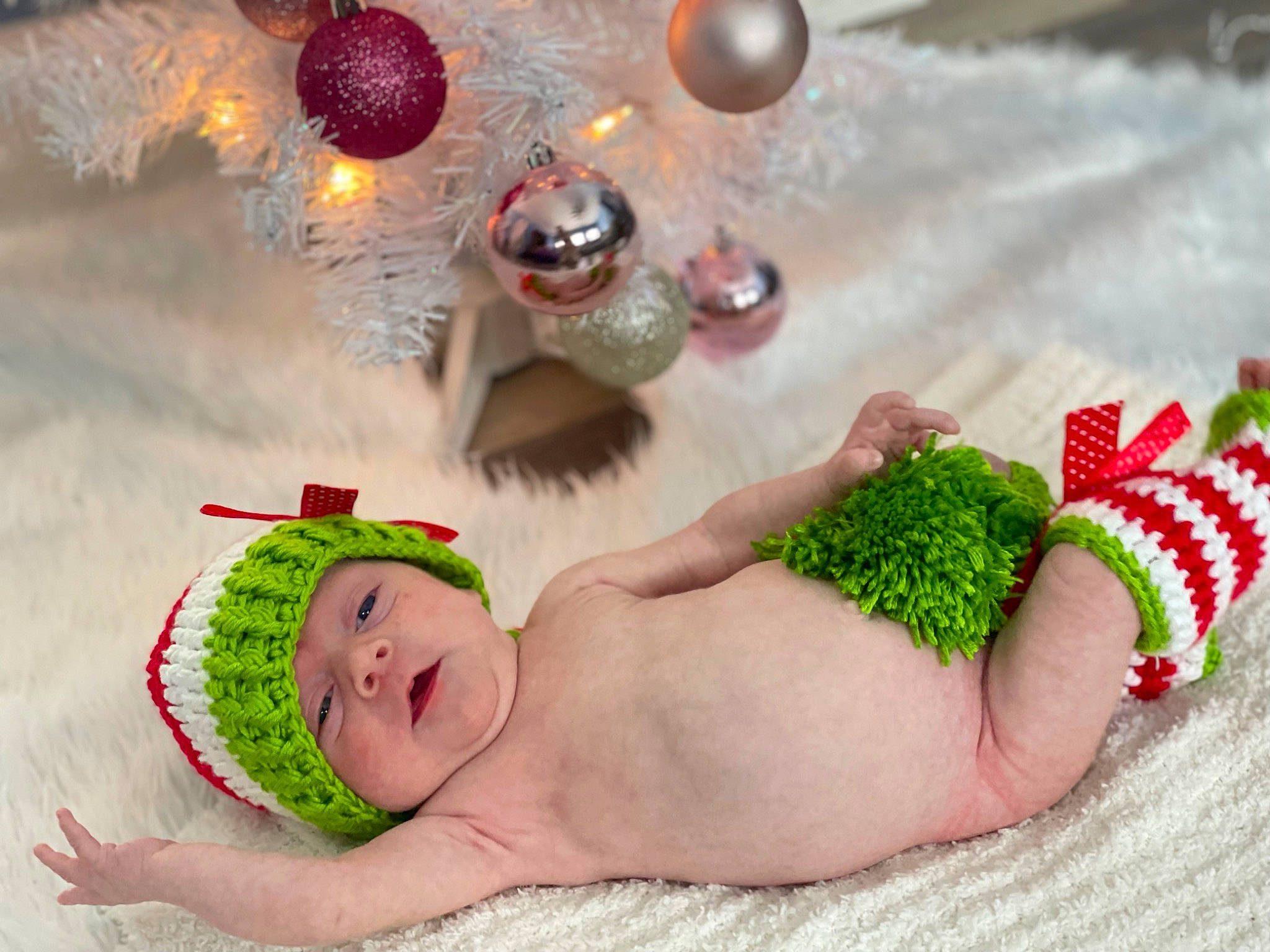 Emersyn is registered to the contest to win money with this photo: art, baby, baby_toddler_clothing, child, christmas_decoration, christmas_ornament, event, fashion_accessory, finger, foot, grass, happy, headgear, headwear, holiday, jewellery, linens, ornament, people_in_nature, person
