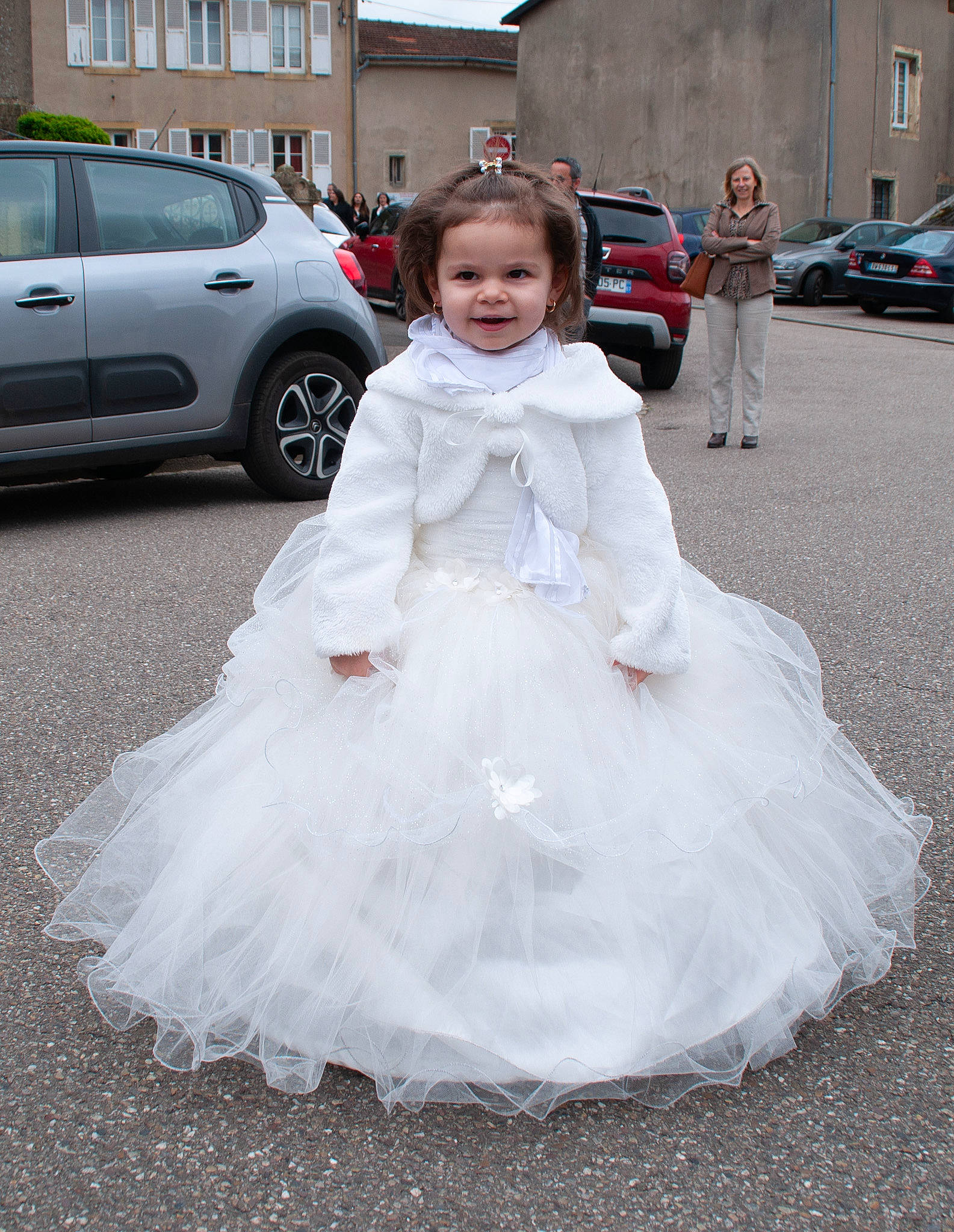 Tiana participe au concours pour gagner de l'argent avec cette photo : asphalt, automotive_design, bridal_accessory, bridal_clothing, bridal_party_dress, car, dress, event, family_car, formal_wear, gown, happy, joy, land_vehicle, person, road, tire, toddler, toy, vehicle