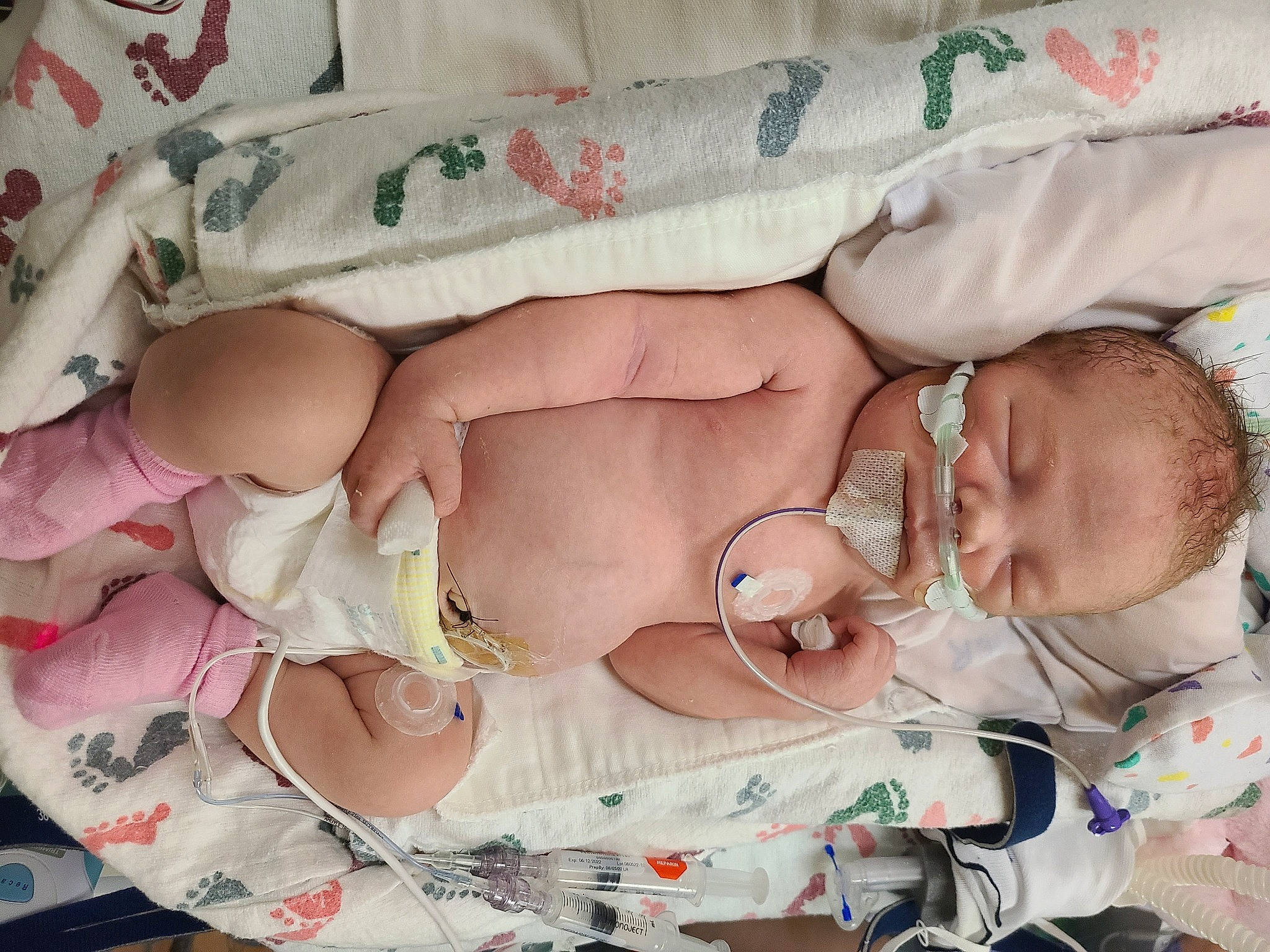 Cora is registered to the contest to win money with this photo: baby, baby_products, baby_sleeping, baby_toddler_clothing, child, comfort, diaper, event, linens, nail, pattern, peach, person, pink, room, skin, sleep, toddler, white