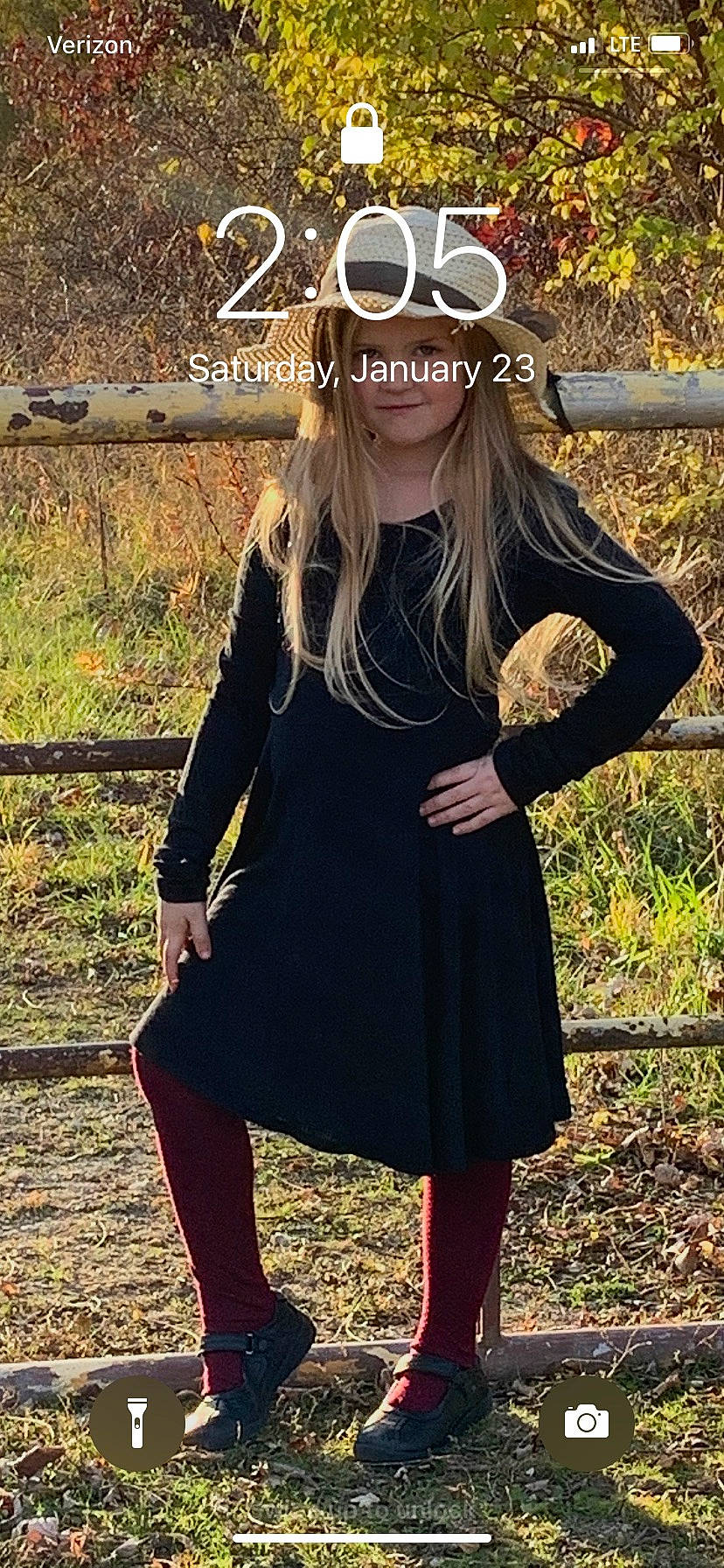 Sayge is registered to the contest to win money with this photo: arm, day_dress, eyewear, fawn, fence, glasses, goggles, grass, happy, headwear, knee, neck, outerwear, person, plant, sleeve, street_fashion, sunglasses, t_shirt, thigh