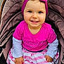 toddler, child, smiling, pink_headband, pink_shirt, striped_skirt, stroller, baby, cute, happy, portrait, outdoor, clothing, seat, person, face, hands, baby_girl, fashion, headwear