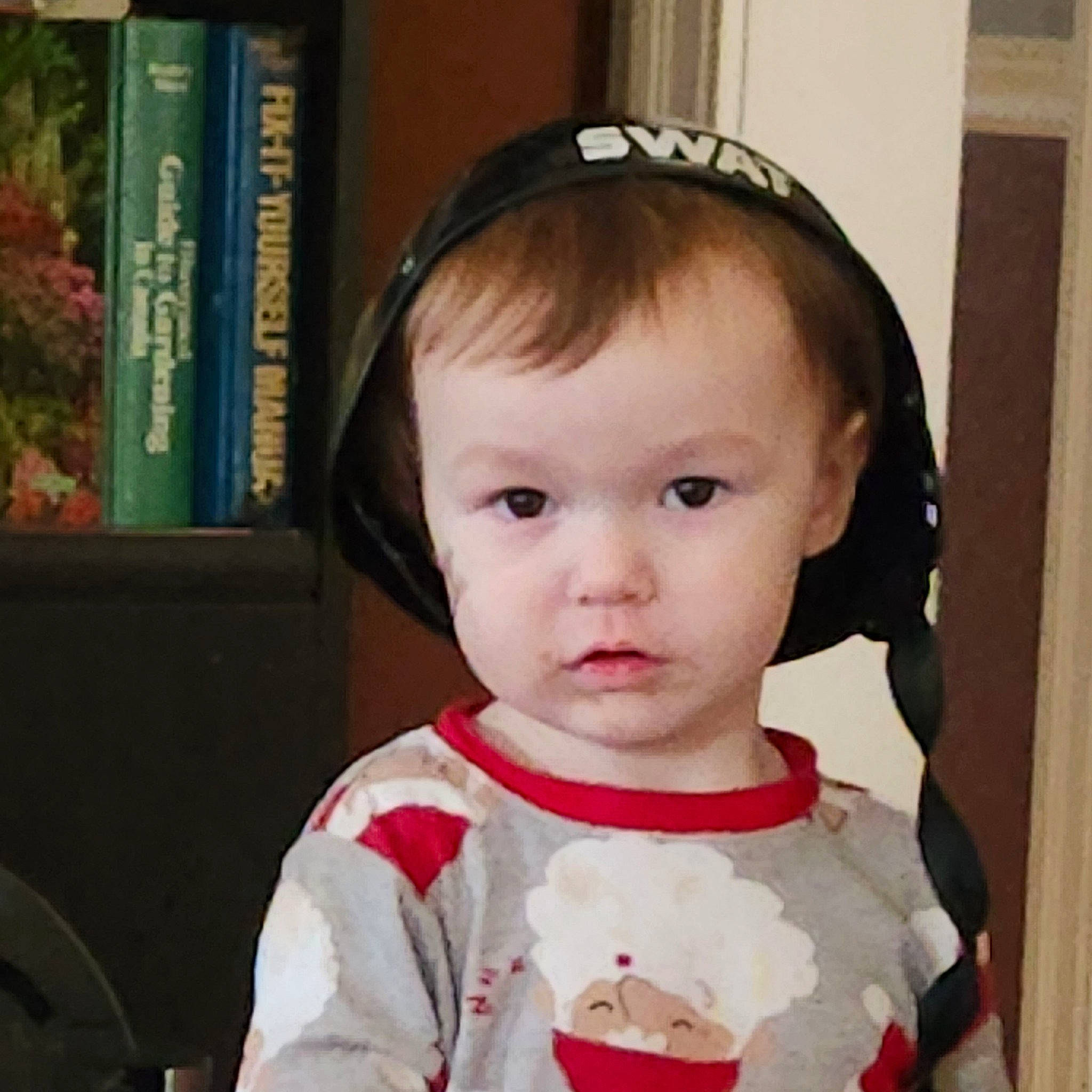 Koa joined the competition — help win amazing prizes! baby, baby_toddler_clothing, black_hair, book, bookcase, cheek, cool, dress, ear, eye, eyebrow, eyelash, hair, happy, head, iris, nose, person, shelf, sleeve