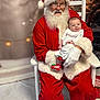 Kagen joined the competition — help win amazing prizes! santa_claus, baby, christmas, holiday, festive, red_suit, white_gloves, beard, smile, chair, decorations, christmas_tree, lights, indoor, portrait, festive_clothing, happy, child, seasonal, celebration