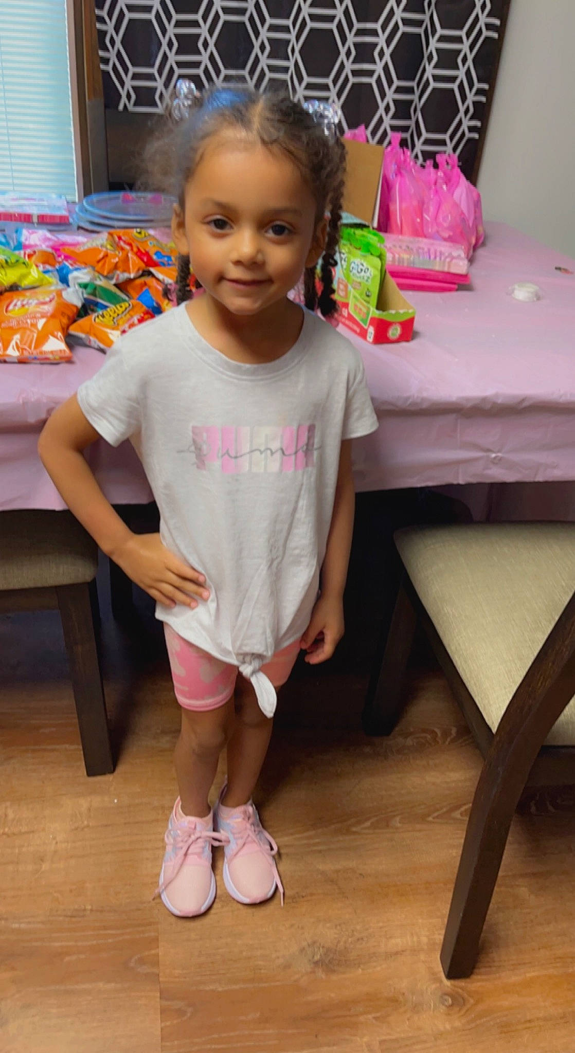 Malayah joined the competition — help win amazing prizes! baby_toddler_clothing, child, face, finger, floor, flooring, hair, hairstyle, happy, head, joy, leg, person, pink, shorts, skin, sleeve, smile, t_shirt, table