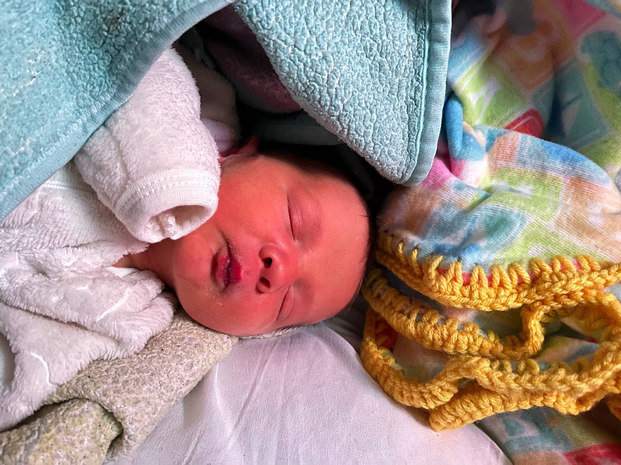 Lucas is registered to the contest to win money with this photo: baby, beanie, bedding, bedtime, cheek, child, comfort, fur, knit_cap, linens, nap, pattern, person, skin, sleep, textile, toddler, tree, wood, wool