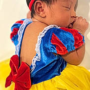 Maiya joined the competition — help win amazing prizes! baby, sleeping, infant, child, costume, dress, headband, bow, yellow, red, blue, tutu, cute, face, hand, skin, newborn, portrait, peaceful, indoors