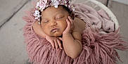Maiya joined the competition — help win amazing prizes! newborn, baby, sleeping, flower_crown, pink_blanket, basket, infant, peaceful, portrait, headband, soft_texture, cute, resting, closeup, skin, hand, face, indoors, cozy, toddler