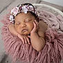 Maiya joined the competition — help win amazing prizes! newborn, baby, sleeping, flower_crown, pink_blanket, basket, infant, peaceful, portrait, headband, soft_texture, cute, resting, closeup, skin, hand, face, indoors, cozy, toddler