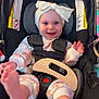 Serenity is registered to the contest to win money with this photo: baby, car_seat, headband, smile, feet, infant, child, happiness, clothing, straps, indoors, person, cute, joyful, seat, playful, young_child, apparel, sitting, foot