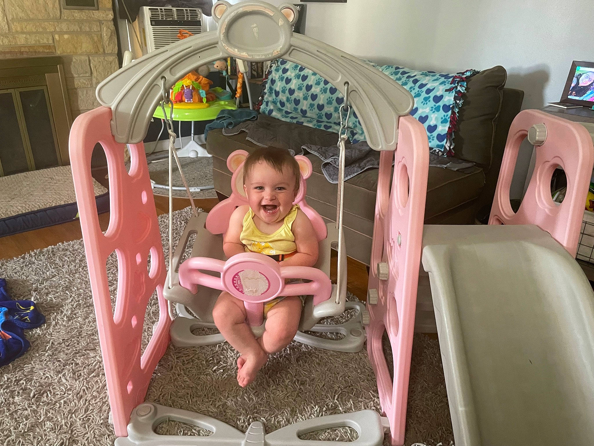 Farrah is registered to the contest to win money with this photo: baby, baby_products, baby_toddler_clothing, chair, child, comfort, couch, flooring, fun, joy, leisure, magenta, mechanical_fan, motor_vehicle, person, play, shorts, sitting, smile, t_shirt