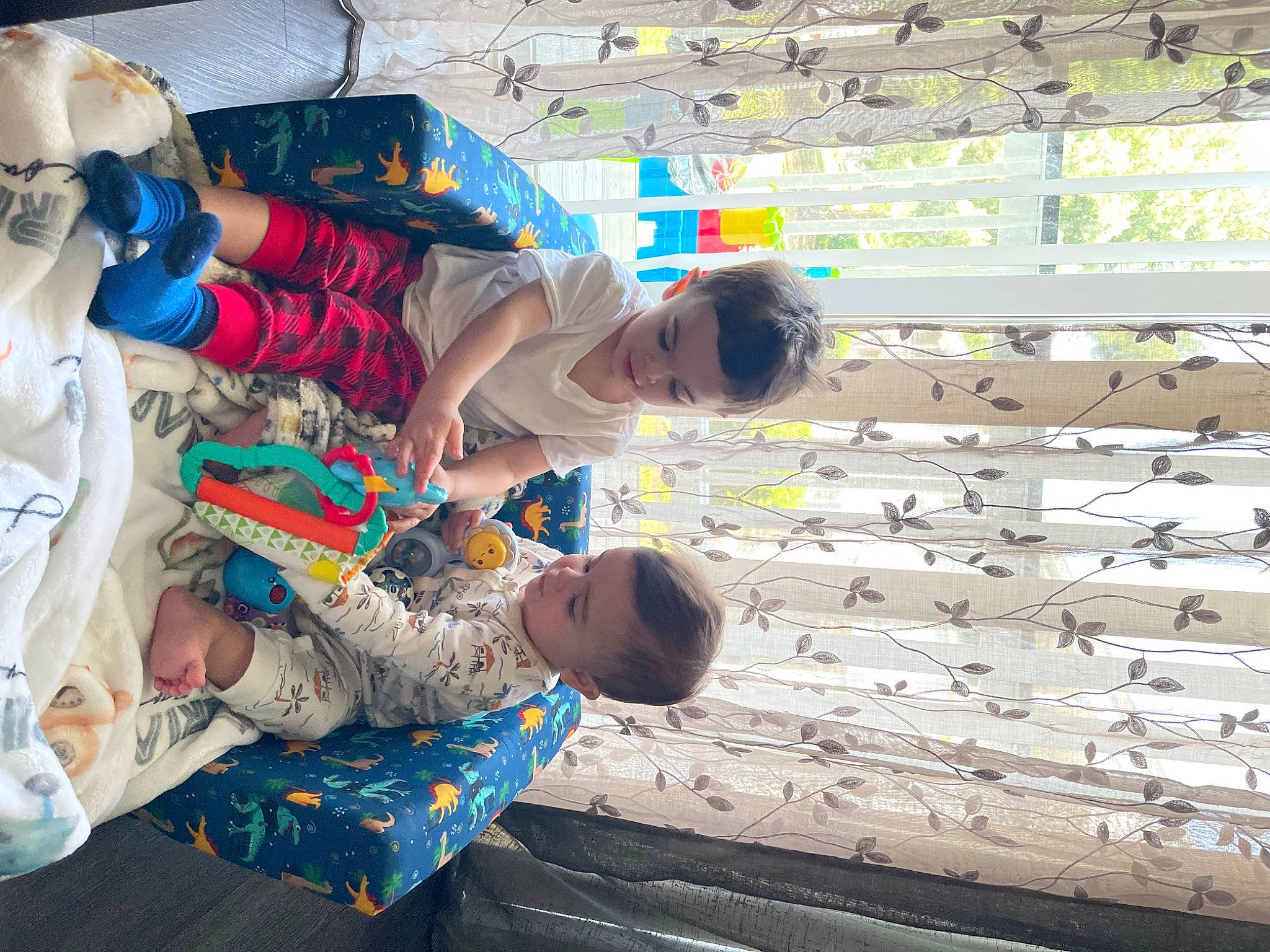 Matteo is registered to the contest to win money with this photo: arm, baby, baby_toddler_clothing, child, design, fun, happy, leisure, pattern, person, play, room, sandal, t_shirt, textile, toddler, travel, vacation, world