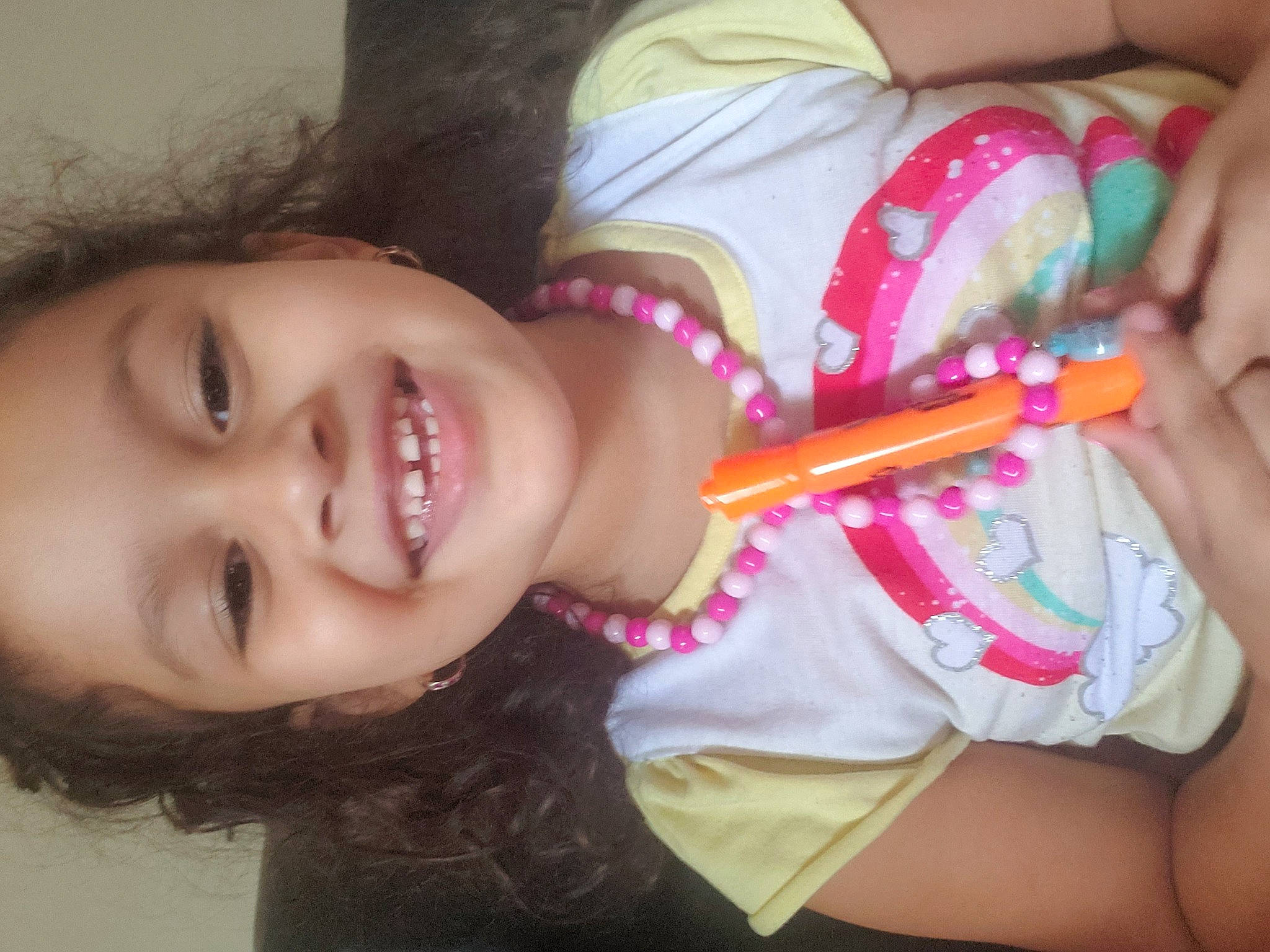 Leah is registered to the contest to win money with this photo: arm, cheek, ear, eyebrow, eyelash, finger, gesture, hand, happy, iris, jaw, joy, lip, mouth, neck, nose, organ, person, pink, skin