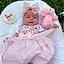 baby, infant, pink_dress, headband, bow, teddy_bear, blanket, outdoor, grass, clover, milestone, sign, cute, soft_toy, sleepwear, footwear, portrait, child, two_months, lying