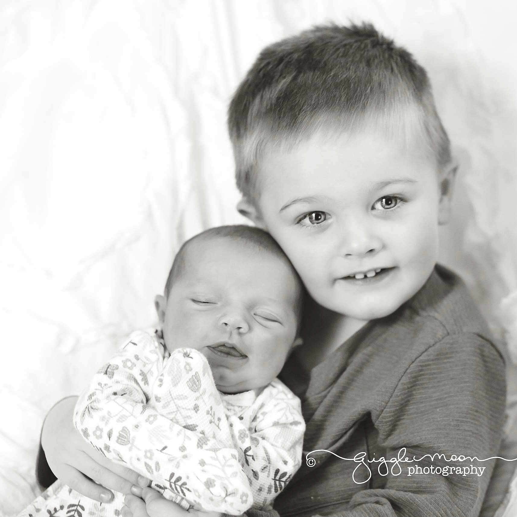 Carson is registered to the contest to win money with this photo: black_and_white, child, facial_expression, family, happiness, infant, iris, laughter, monochrome, monochrome_photography, mother, people, person, photograph, photography, portrait, portrait_photography, sibling, skin, smile