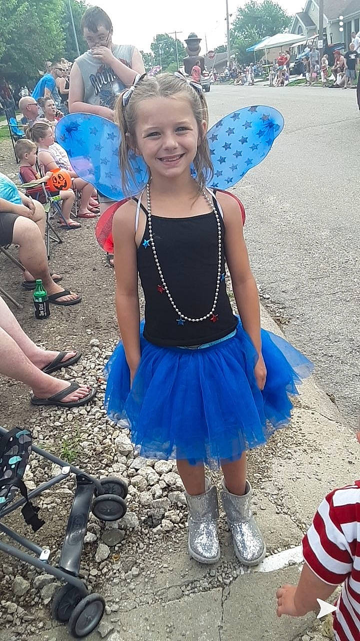 Alika is registered to the contest to win money with this photo: blue, carnival, child, clothing, costume, dress, electric_blue, festival, fun, joy, person, smile, style, summer, water