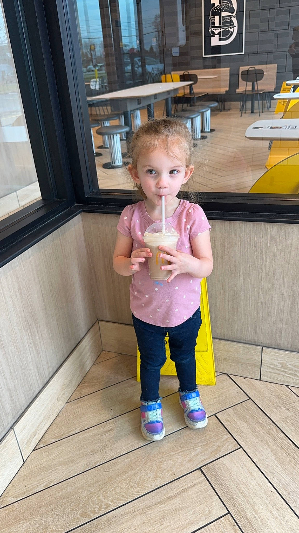 Payton is registered to the contest to win money with this photo: baby, baby_toddler_clothing, child, floor, flooring, fun, hardwood, leg, leisure, person, play, room, sitting, standing, t_shirt, toddler, vacation, varnish, wood