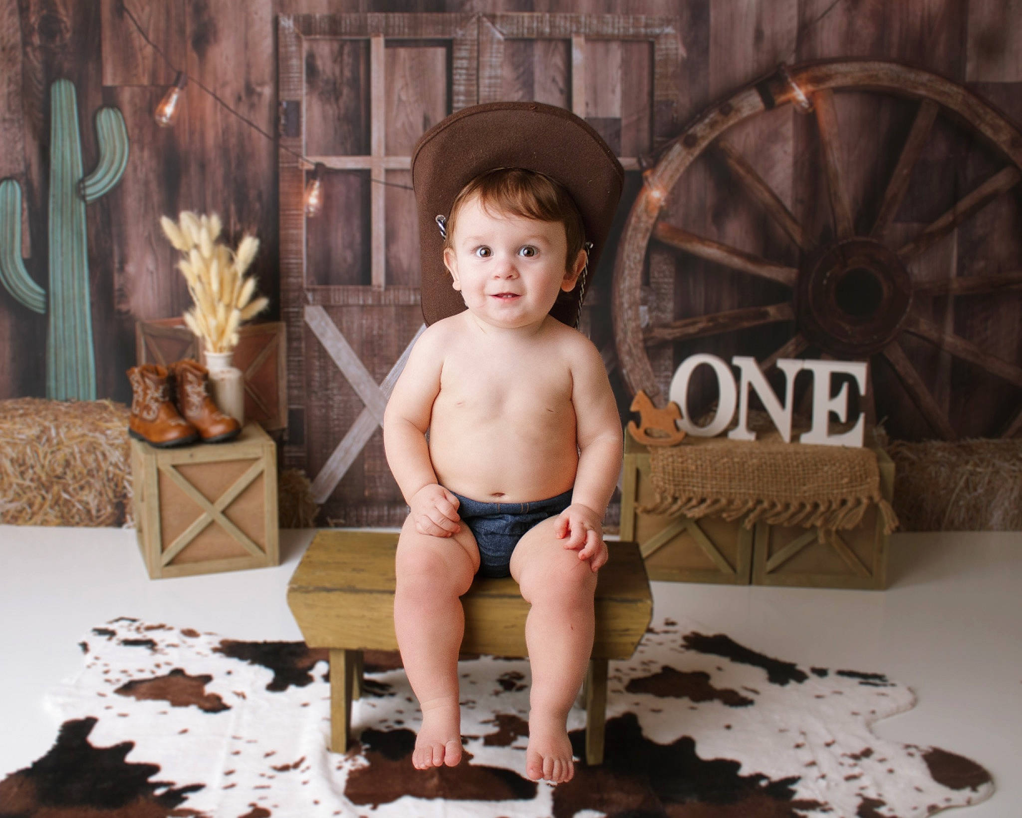 Sawyer is registered to the contest to win money with this photo: abdomen, automotive_tire, baby, barechested, chest, flash_photography, flooring, foot, fun, happy, hat, joy, person, plant, room, shorts, sitting, smile, thigh, toddler