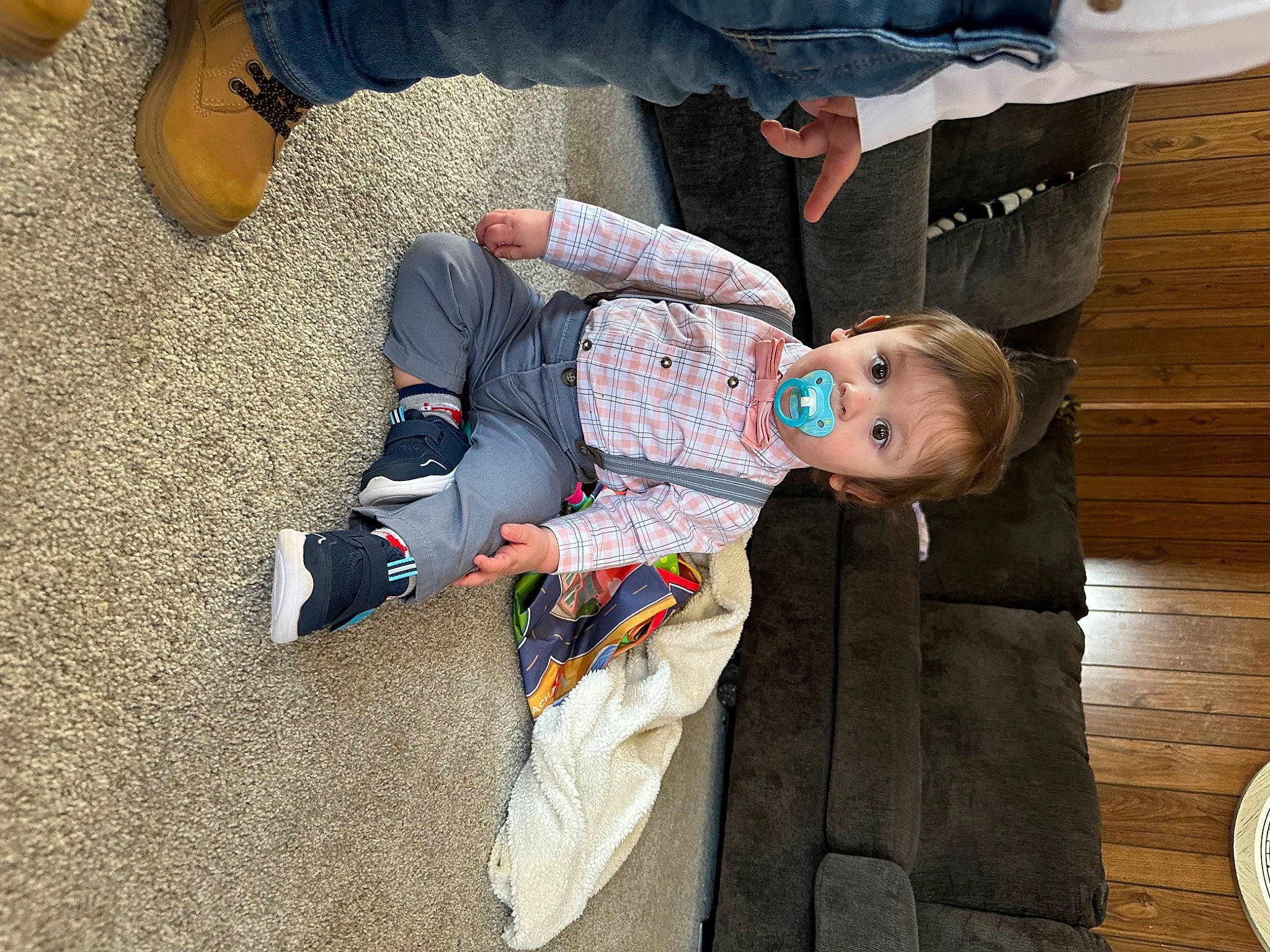 Sawyer is registered to the contest to win money with this photo: baby, baby_products, child, comfort, flooring, foot, fun, grass, human_leg, lap, leg, leisure, mammal, person, shoe, sitting, sneakers, suit, toddler, tree