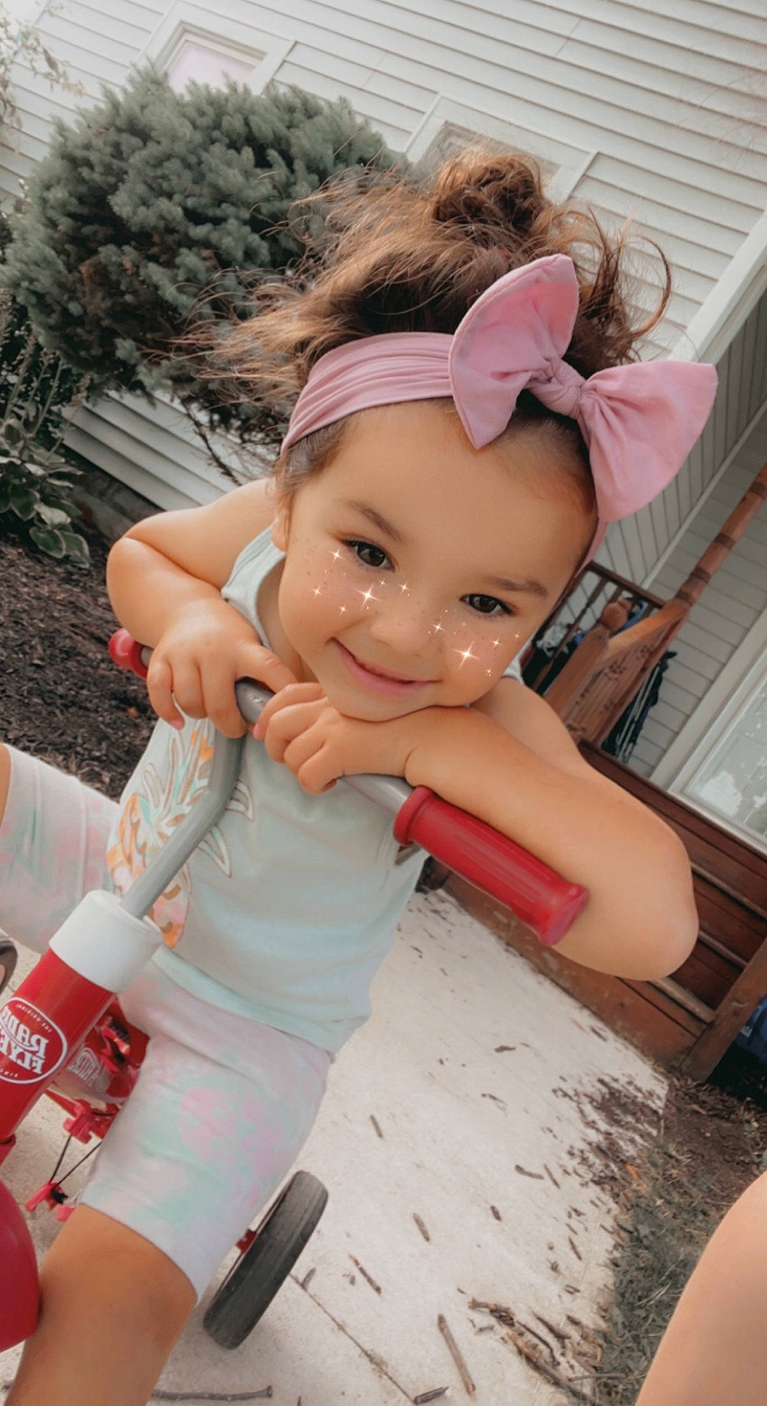 Laikynn is registered to the contest to win money with this photo: arm, child, doll, eyelash, face, finger, fun, grass, hand, happy, headwear, joint, joy, leisure, person, pink, skin, smile, textile, thigh