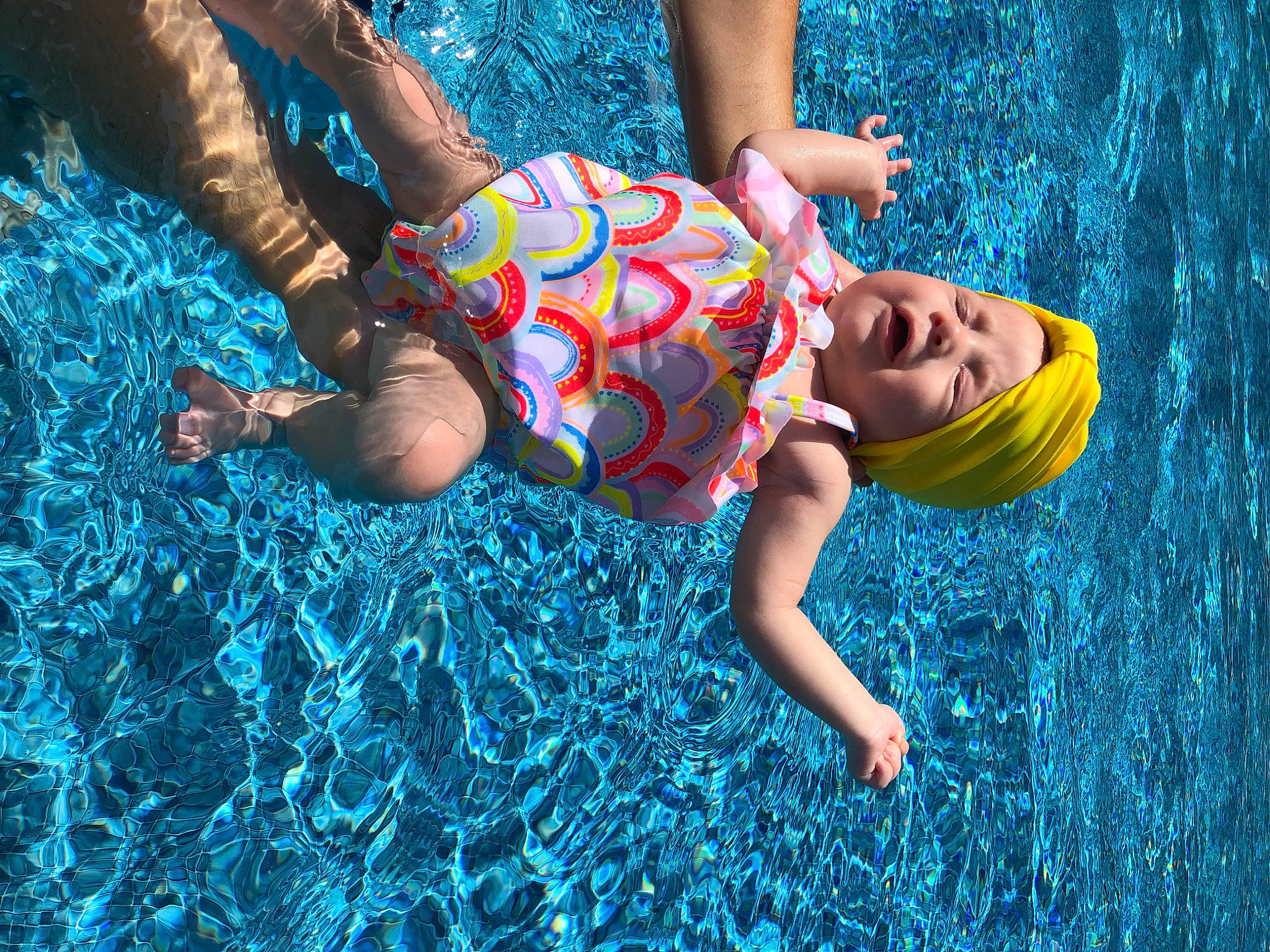 Charlotte is registered to the contest to win money with this photo: aqua, azure, barefoot, beauty, blue, child, electric_blue, flash_photography, fun, grass, happy, human_leg, leisure, people_in_nature, person, recreation, smile, sunlight, swimwear, thigh