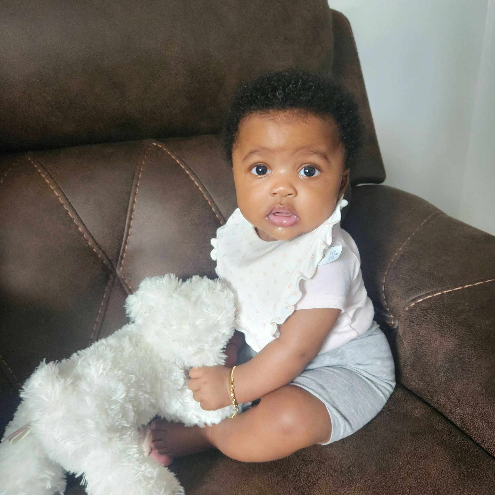 Arielle is registered to the contest to win money with this photo: animal, baby, ball, canine, chair, couch, cushion, dog, face, football, furniture, head, homedecor, person, pet, photography, portrait, sitting, soccer, soccerball