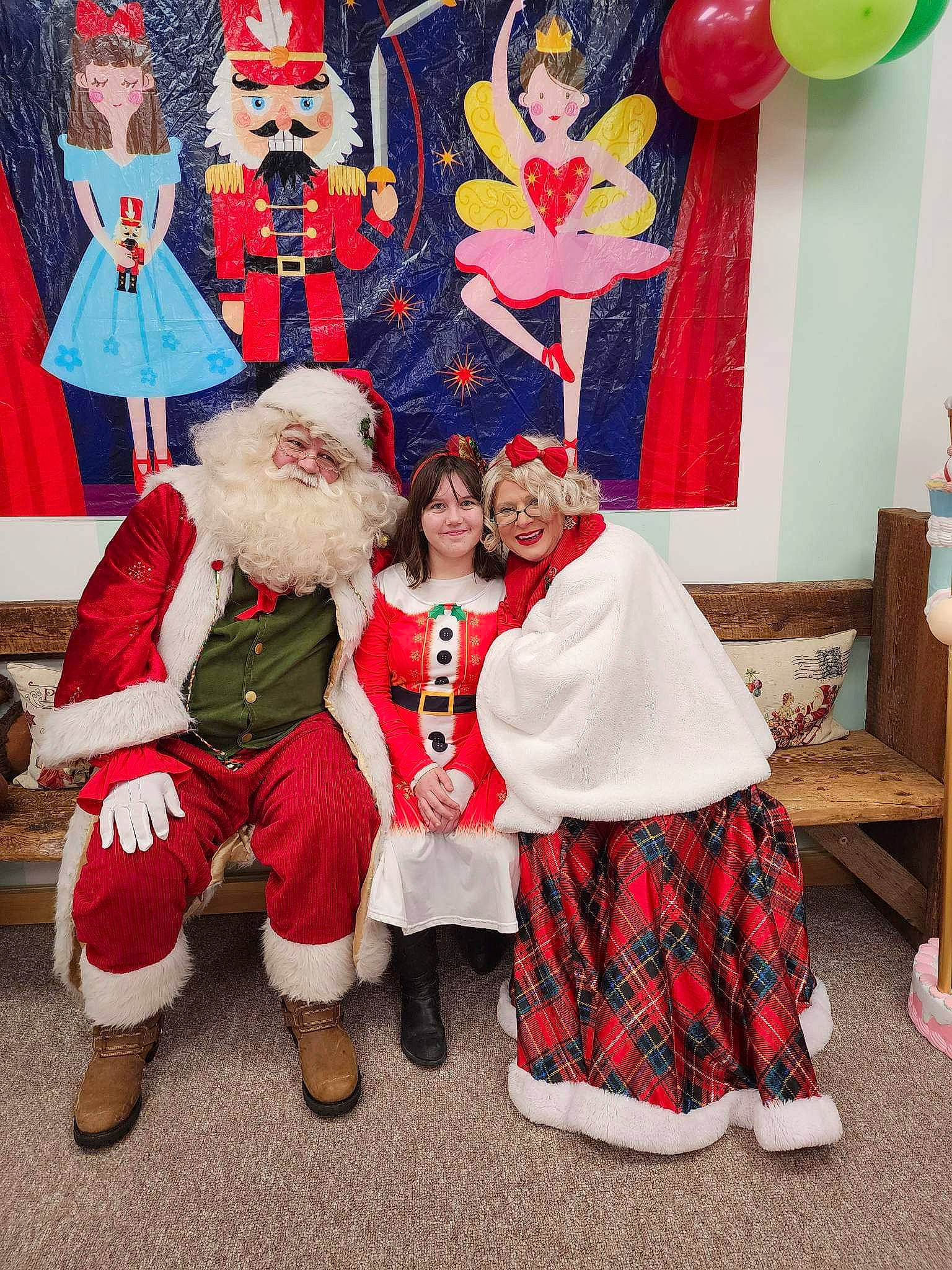 Rayne is registered to the contest to win money with this photo: balloon, beard, christmas, christmas_eve, costume, event, fictional_character, fun, fur, happy, hat, holiday, joy, pattern, person, red, room, santa_claus, smile, tartan