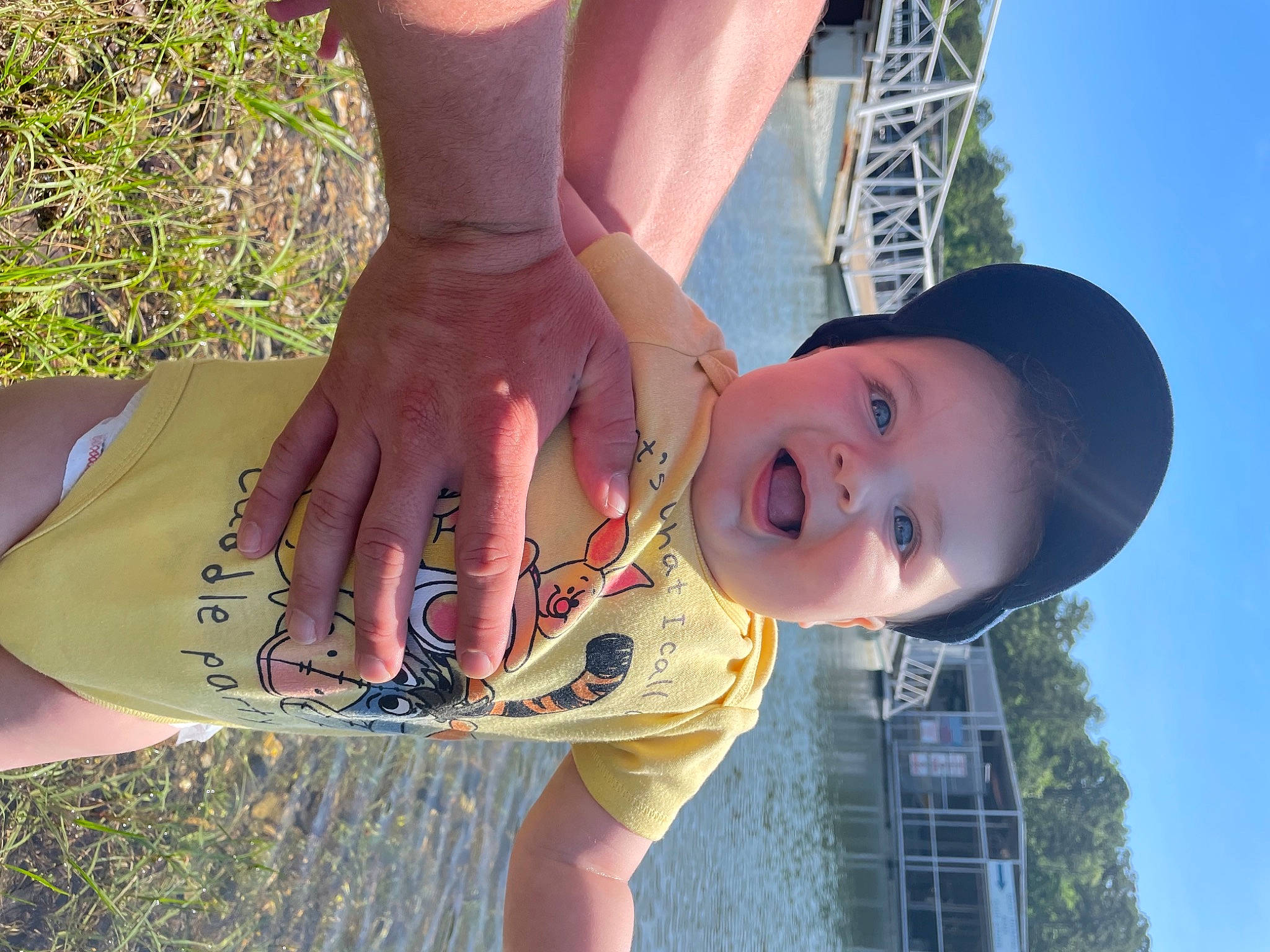 Leland is registered to the contest to win money with this photo: cool, gesture, grass, hairstyle, happy, hat, human_body, knee, leg, leisure, light, lip, person, skin, sky, smile, sun_hat, sunlight, thigh, tree