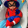 baby, child, costume, spiderman, mask, hood, red, blue, socks, seat, baby_seat, indoor, cute, infant, portrait, clothing, person, resting, young, casual