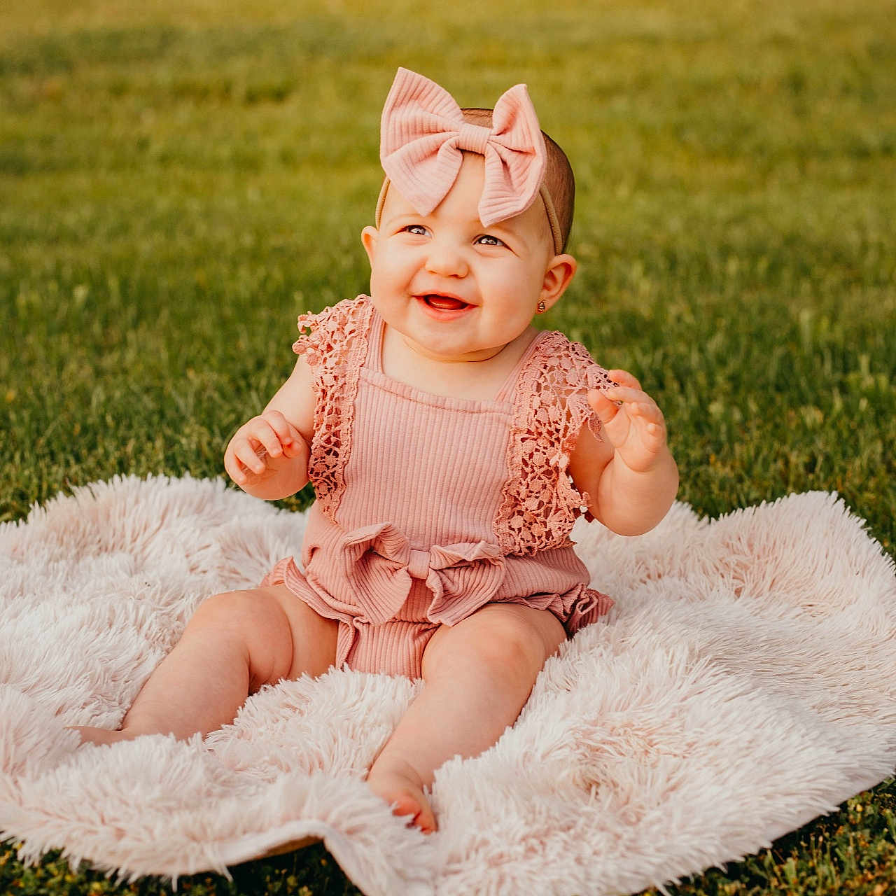 Ivy joined the competition — help win amazing prizes! baby, clothing, dress, face, flower, grass, happy, hat, head, lawn, nature, outdoors, park, person, photography, plant, portrait, sitting, smile, summer