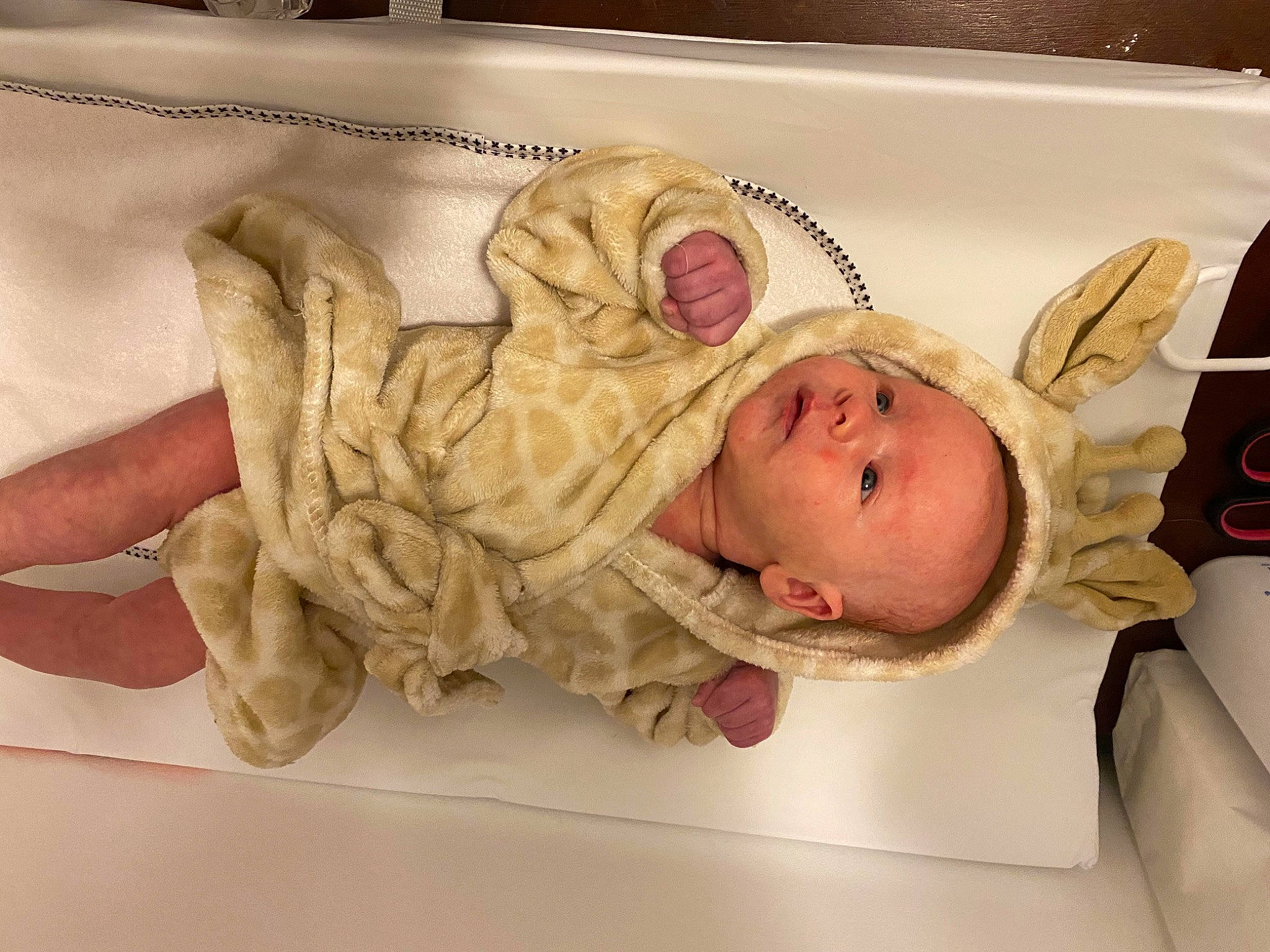 Portland is registered to the contest to win money with this photo: baby, baby_products, baby_safety, baby_sleeping, baby_toddler_clothing, bedding, bedtime, child, comfort, eye, gesture, hat, headgear, infant_bed, linens, person, room, sleeve, smile, textile