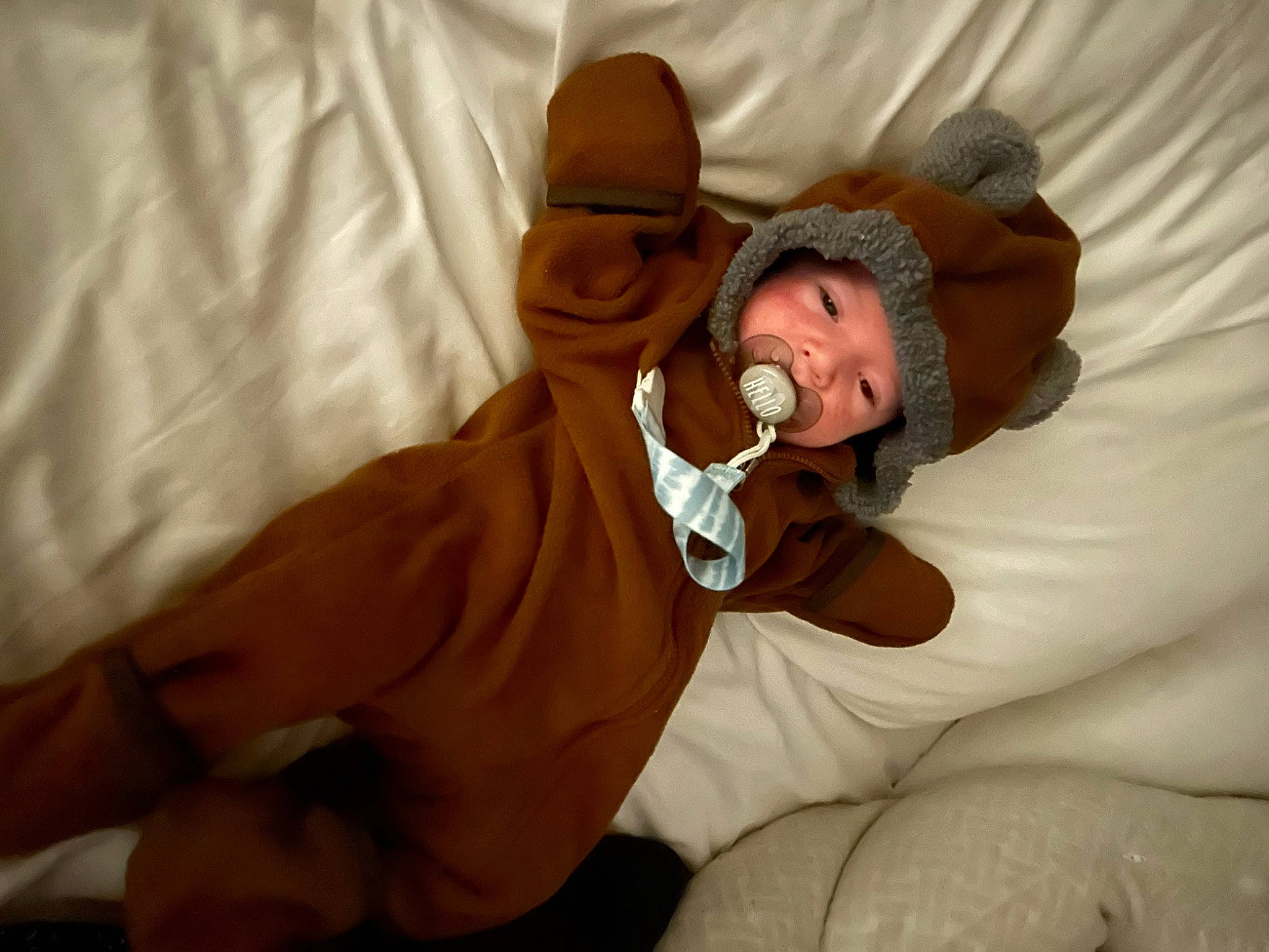 Thomas joined the competition — help win amazing prizes! abdomen, baby, chest, child, comfort, companion_dog, ear, elbow, gesture, hat, headwear, human_leg, knee, linens, person, room, sitting, thigh, thumb, toddler