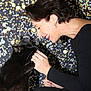 Eugène a rejoint le concours — aidez-le/la à gagner de superbes lots ! woman, black_cat, pet, smiling, face, hand, feline, interaction, happy, indoor, portrait, animal, human, cute, friendship, black_clothing, short_hair, earring, bokeh, background