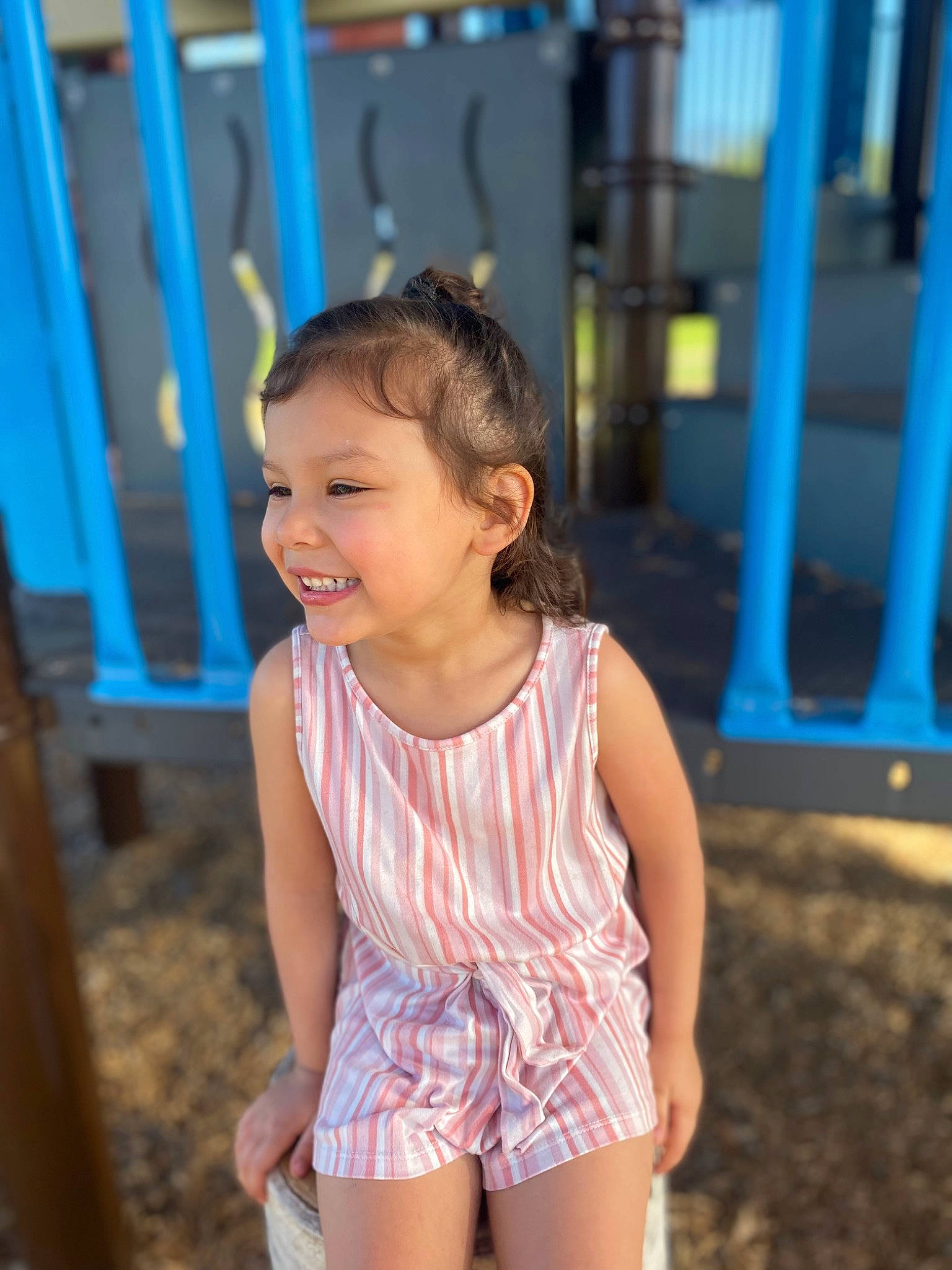 Sequoia is registered to the contest to win money with this photo: blue, child, eye, fun, grass, hair, hairstyle, happy, human_body, human_leg, joy, leisure, person, recreation, sitting, smile, summer, t_shirt, thigh, toddler