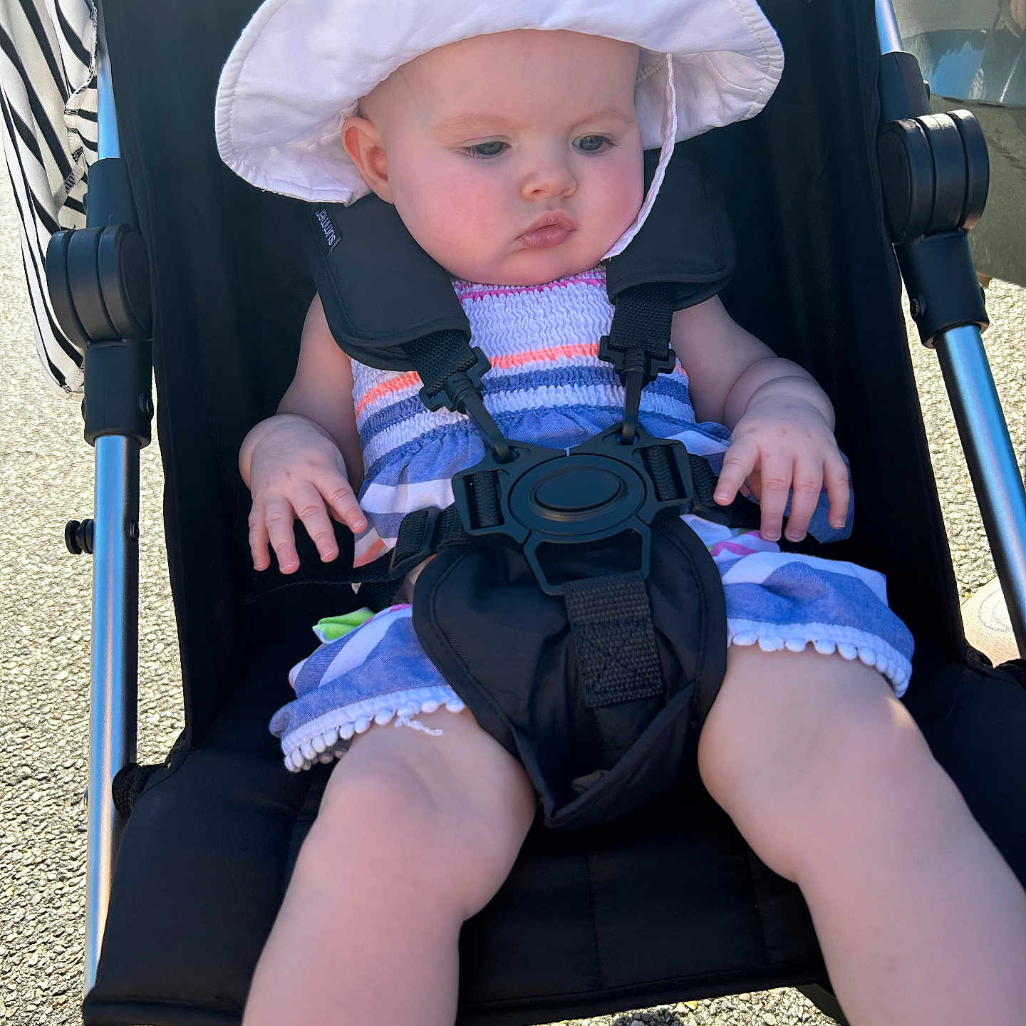 Mahala is registered to the contest to win money with this photo: baby, baseballcap, bonnet, cap, clothing, costume, dress, face, footwear, furniture, hat, head, person, photography, portrait, shoe, shorts, sitting, stroller, sunhat