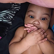Brandyn Joseph Jr joined the competition — help win amazing prizes! baby, blanket, child, closeup, comfortable, cute, expression, eyes, fabric, face, hands, indoors, infant, lying_down, person, playful, portrait, skin, soft, young