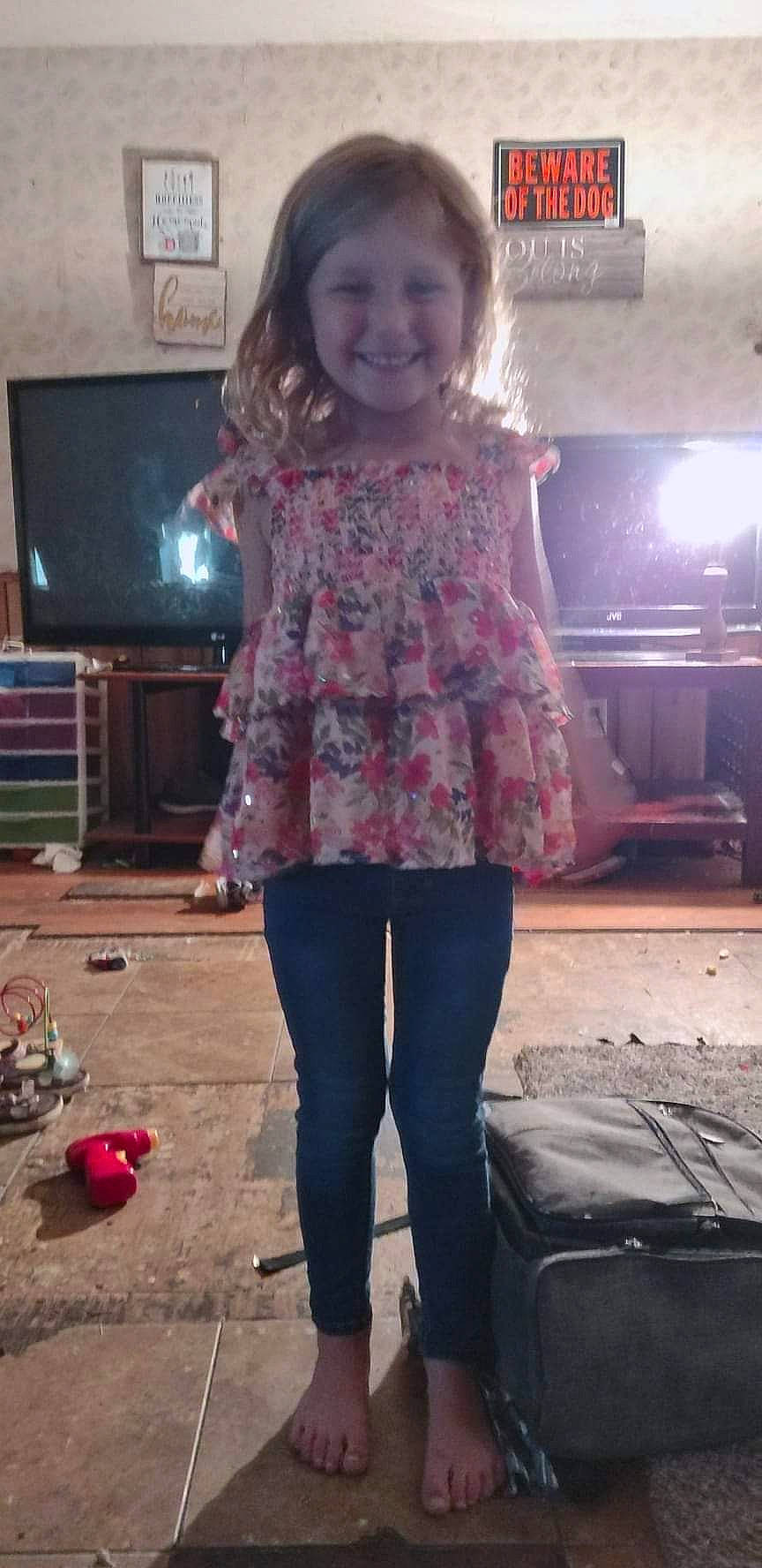 Aubrey Lynn is registered to the contest to win money with this photo: denim, fashion_accessory, fun, human_leg, joint, joy, knee, leggings, long_hair, magenta, pattern, person, picture_frame, pink, sitting, sleeve, smile, standing, television, thigh