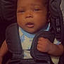 baby, child, car_seat, infant, seatbelt, straps, clothing, hand, face, portrait, safety, child_seat, car, infant_clothing, cute, young_child, baby_boy, indoors, closeup, expression