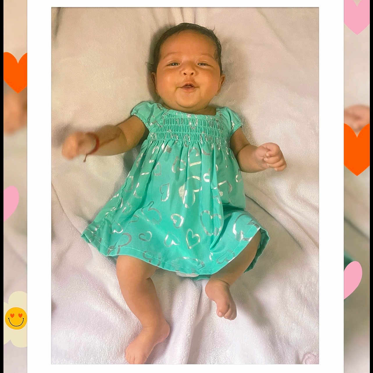 Briana Gutierrez joined the competition — help win amazing prizes! baby, infant, child, portrait, smiling, lying_down, turquoise_dress, heart_pattern, blanket, indoor, close_up, face, hands, bare_feet, soft_lighting, decorative_frame, hearts, flowers, date_text, hashtag