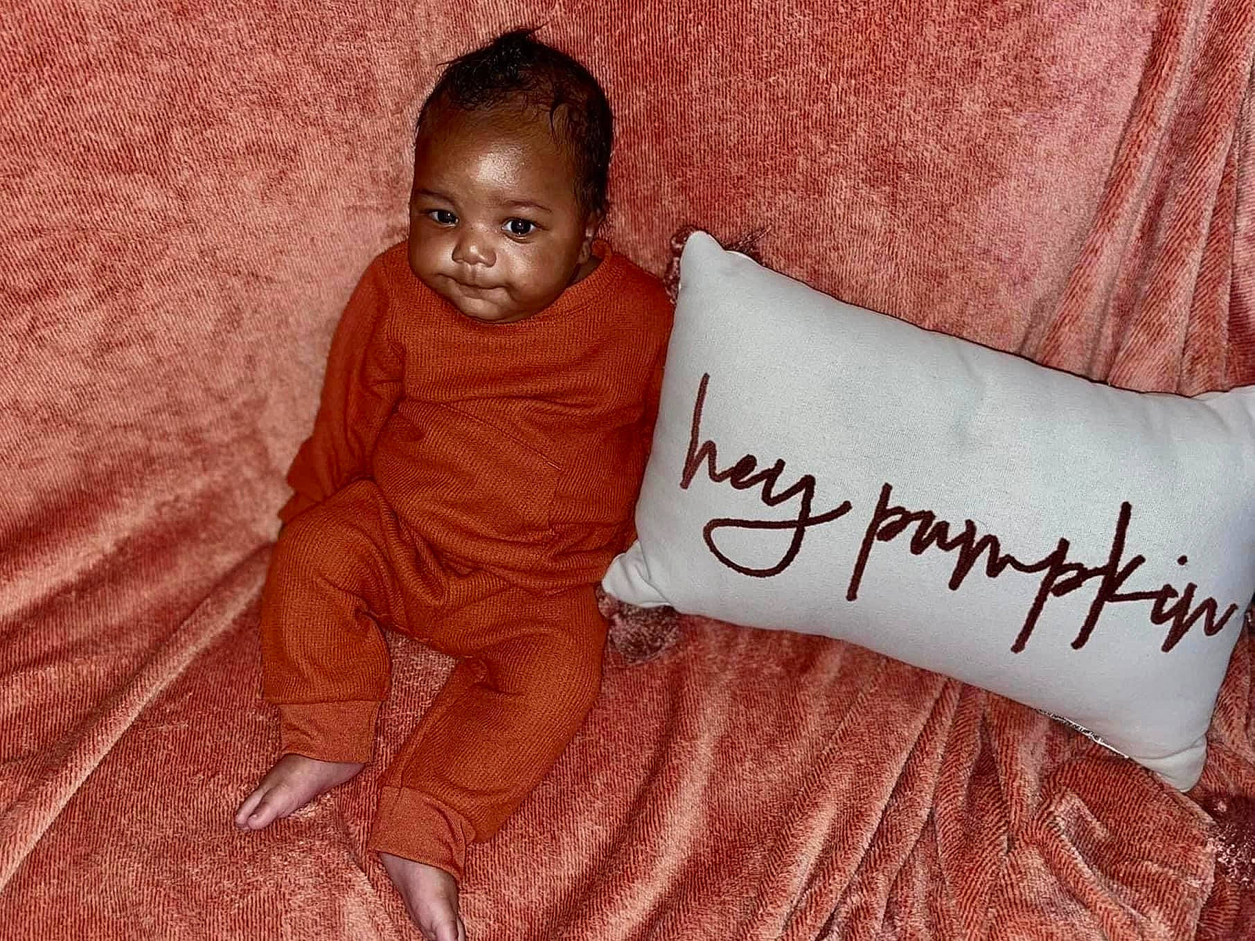 Makai is registered to the contest to win money with this photo: baby_toddler_clothing, beauty, comfort, design, finger, font, handwriting, happy, human, linens, mammal, person, pillow, pink, product, skin, sleeve, t_shirt, textile, toddler