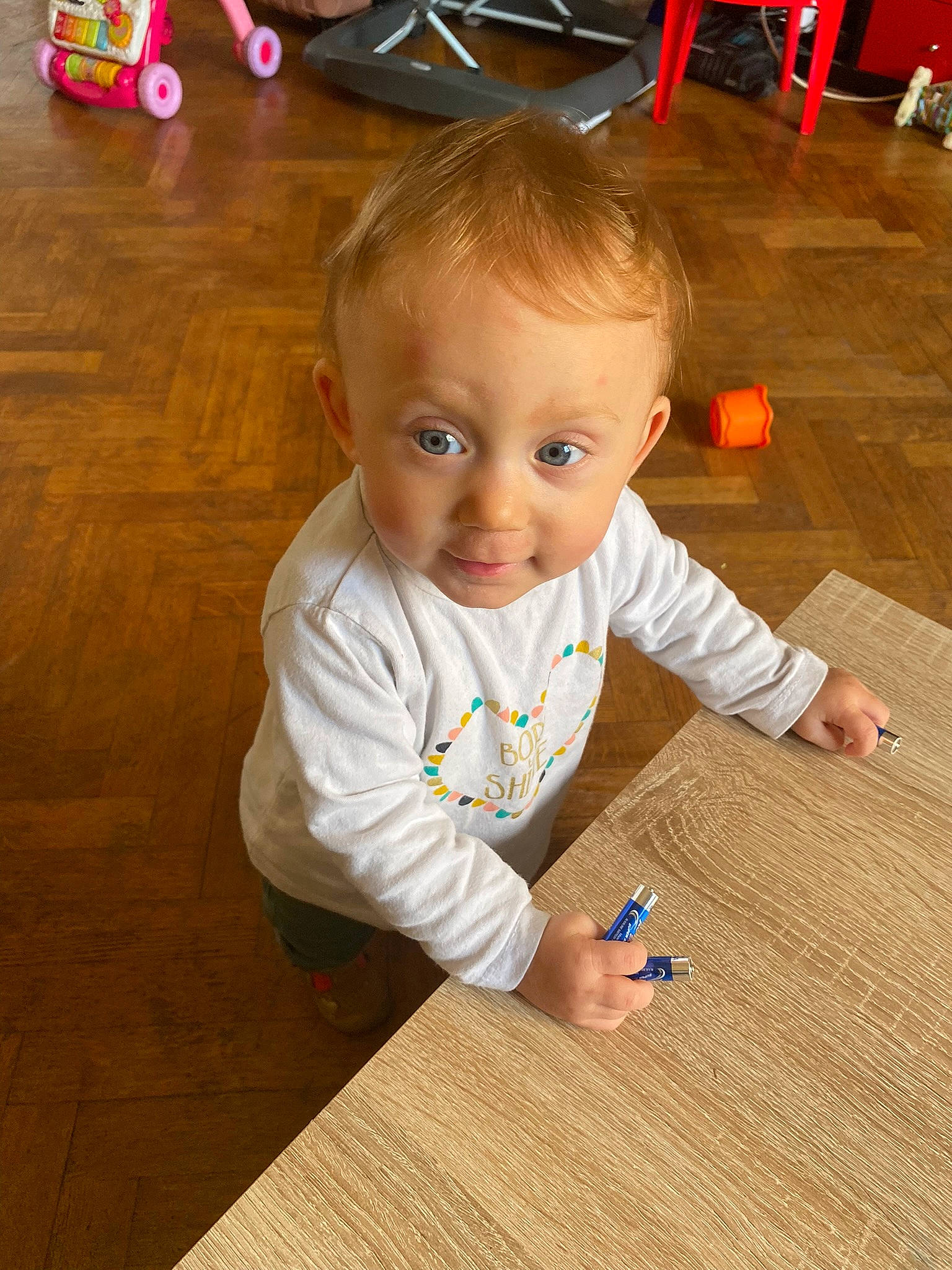 Isalyne participe au concours pour gagner de l'argent avec cette photo : baby, baby_toddler_clothing, cheek, child, facial_expression, finger, floor, flooring, hair, hardwood, head, laminate_flooring, nose, person, skin, smile, thumb, toddler, varnish, wood