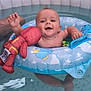 Freddie joined the competition — help win amazing prizes! baby, pool, water, inflatable_ring, toy, red_plush, child, smiling, floating, summer, happy, blue, stars, cartoon, splashing, feet, skin, person, outdoor, fun