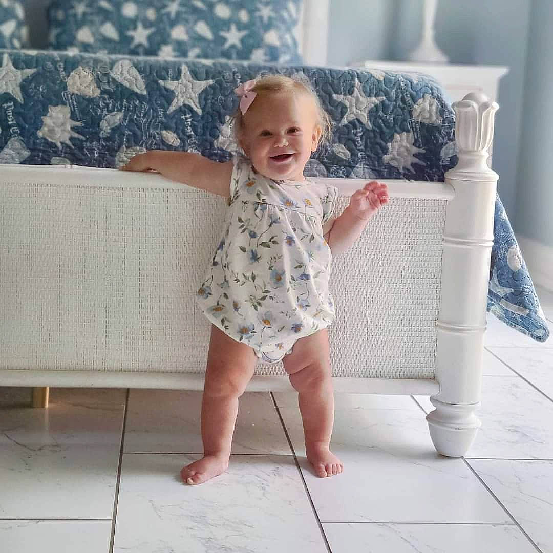 Blaire joined the competition — help win amazing prizes! baby, baby_toddler_clothing, barefoot, comfort, couch, dress, face, finger, floor, flooring, hand, head, joy, pattern, person, product, sleeve, smile, standing, textile
