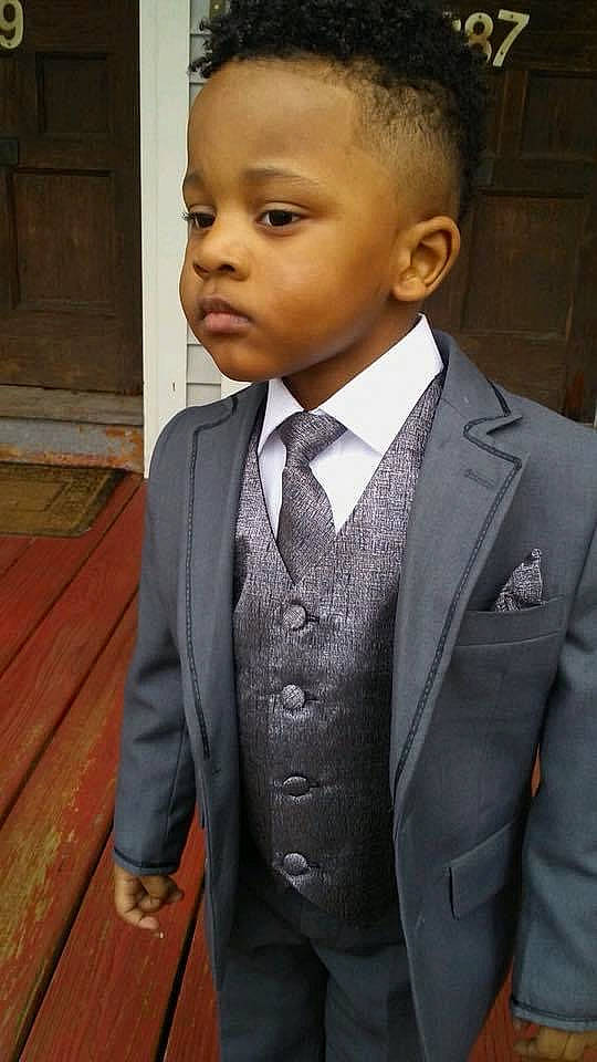 Lee is registered to the contest to win money with this photo: blazer, child, formal_wear, hairstyle, outerwear, person, suit, tie, tuxedo