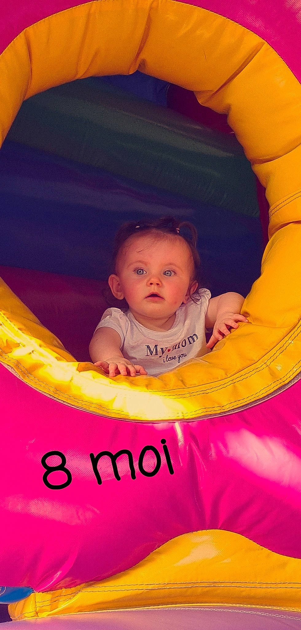 Kayline participe au concours pour gagner de l'argent avec cette photo : baby, baby_products, baby_toddler_clothing, child, circle, eye, flash_photography, fun, happy, leisure, magenta, mouth, organ, person, pink, plant, play, recreation, sitting, tints_and_shades