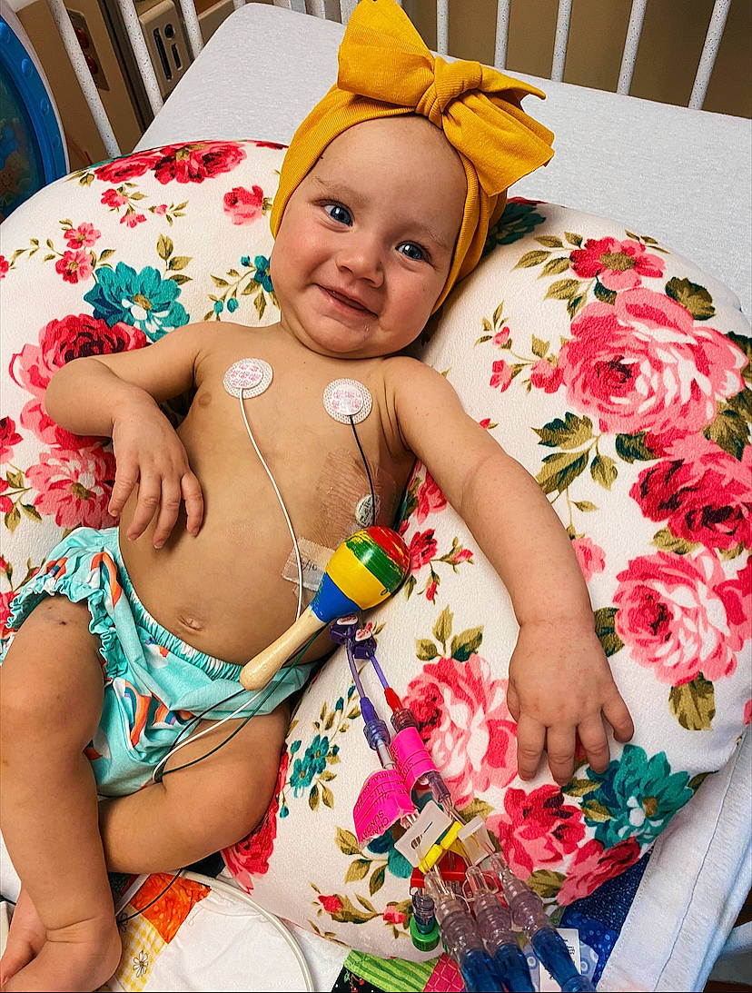 Charley joined the competition — help win amazing prizes! abdomen, baby, baby_toddler_clothing, child, event, finger, flower, flower_arranging, happy, headgear, joy, orange, people, person, petal, pink, product, skin, smile, textile