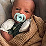 baby, newborn, pacifier, blanket, mittens, infant, face, cushion, seat, closeup, cozy, resting, child, cute, warm, sleepwear, portrait, indoor, soft, comfort